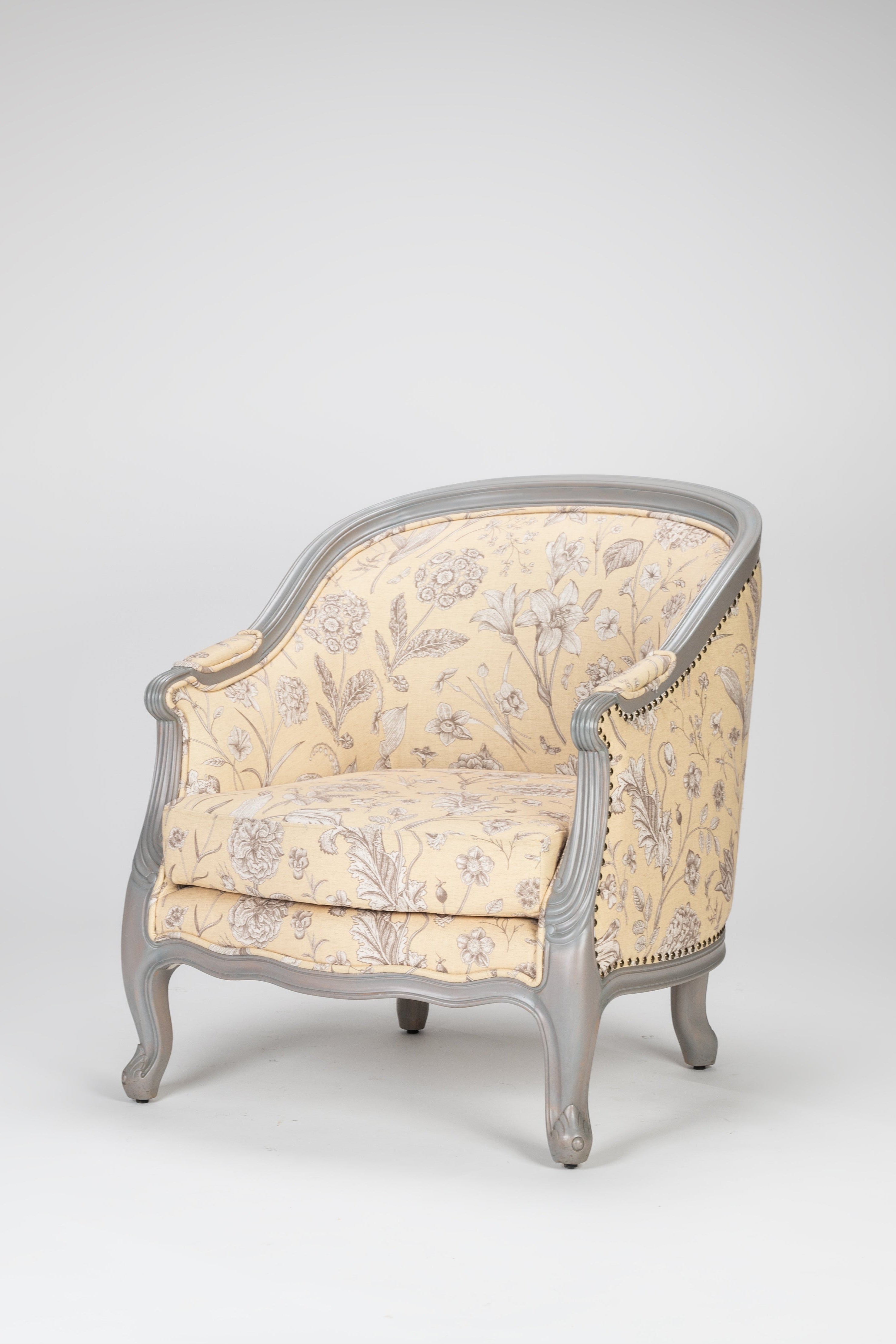 Decorative armchair with floral pattern on a gray background