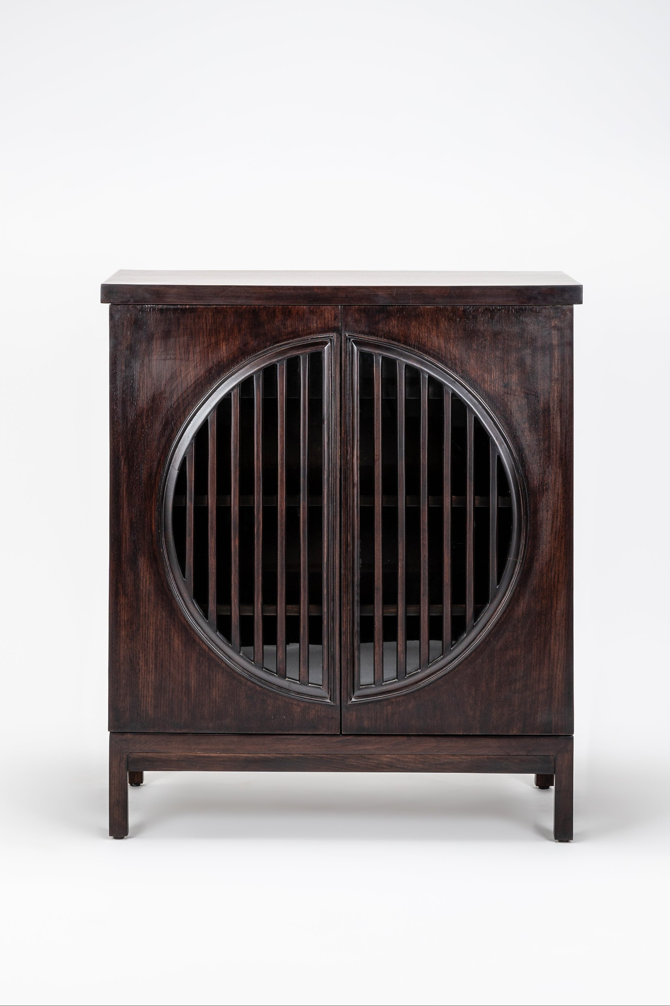 Wooden cabinet with round door on a white background