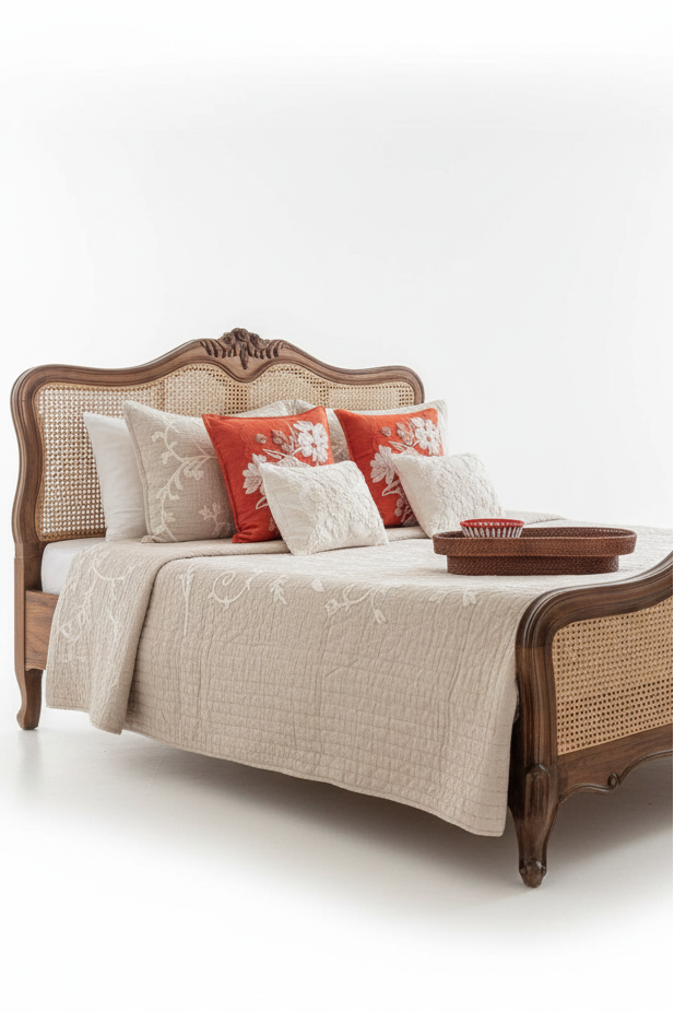 Decorative bed with wooden frame and caned sides on a white background