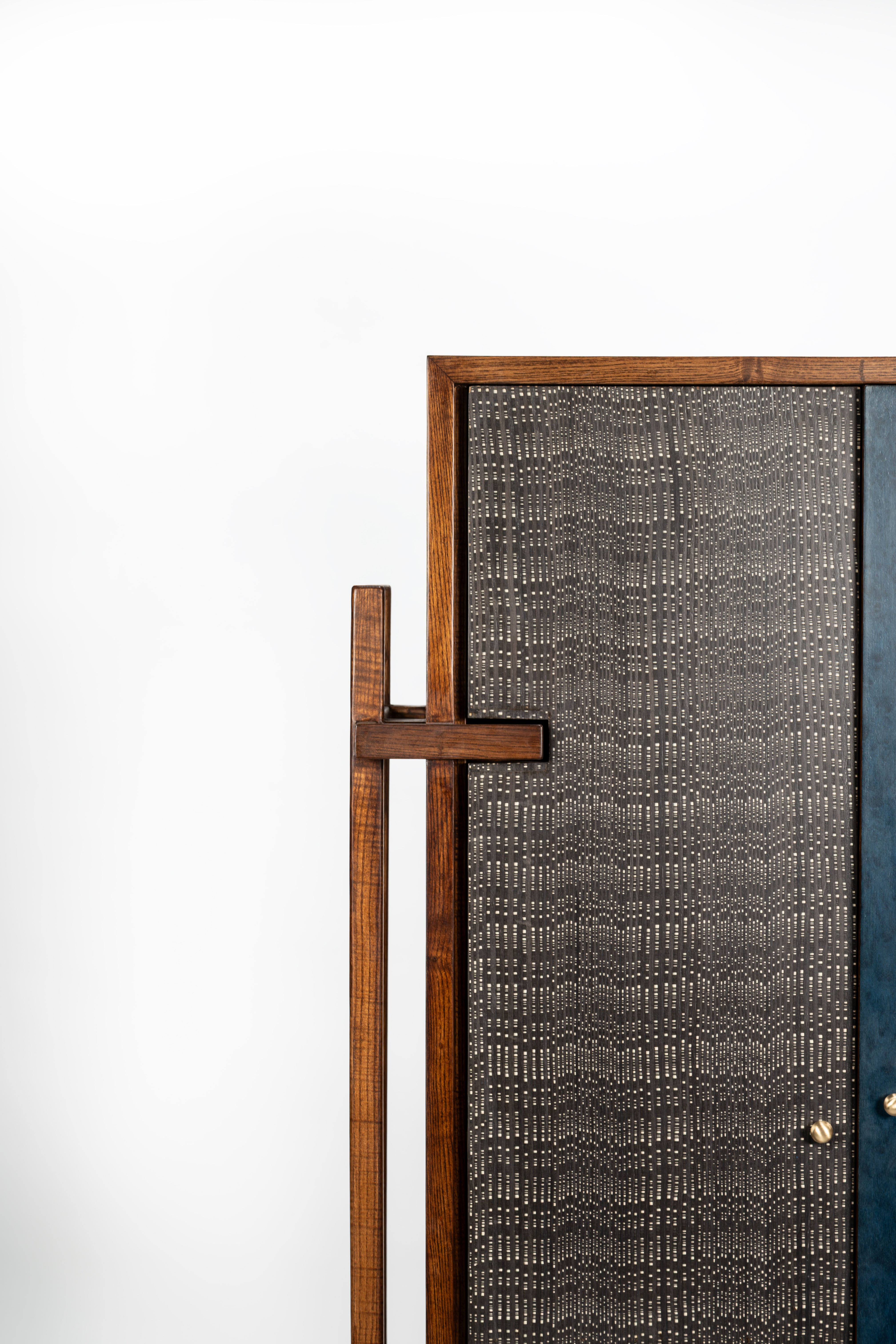 Textured door with wooden handle on a white background