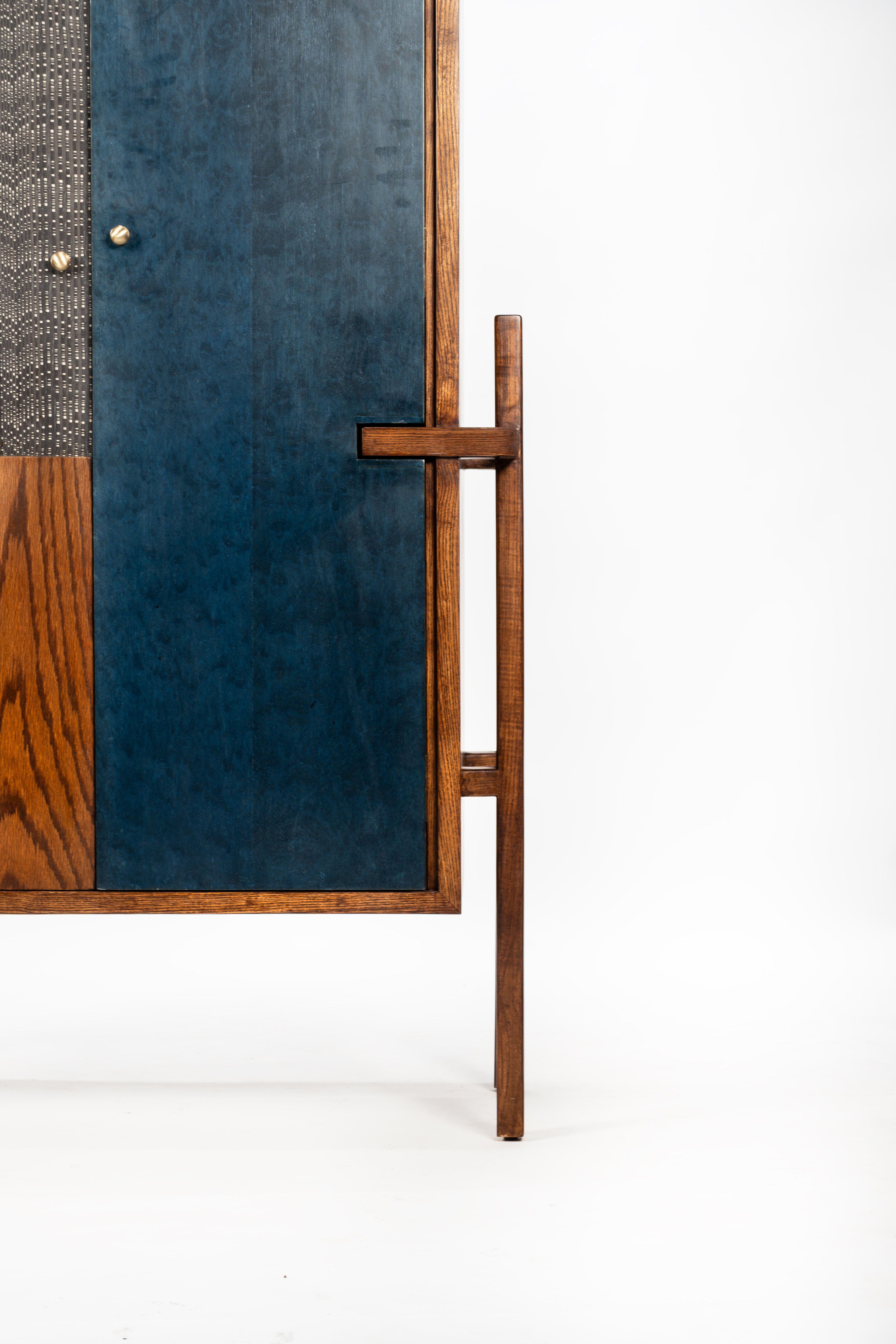 Wooden screen with blue panel on a white background