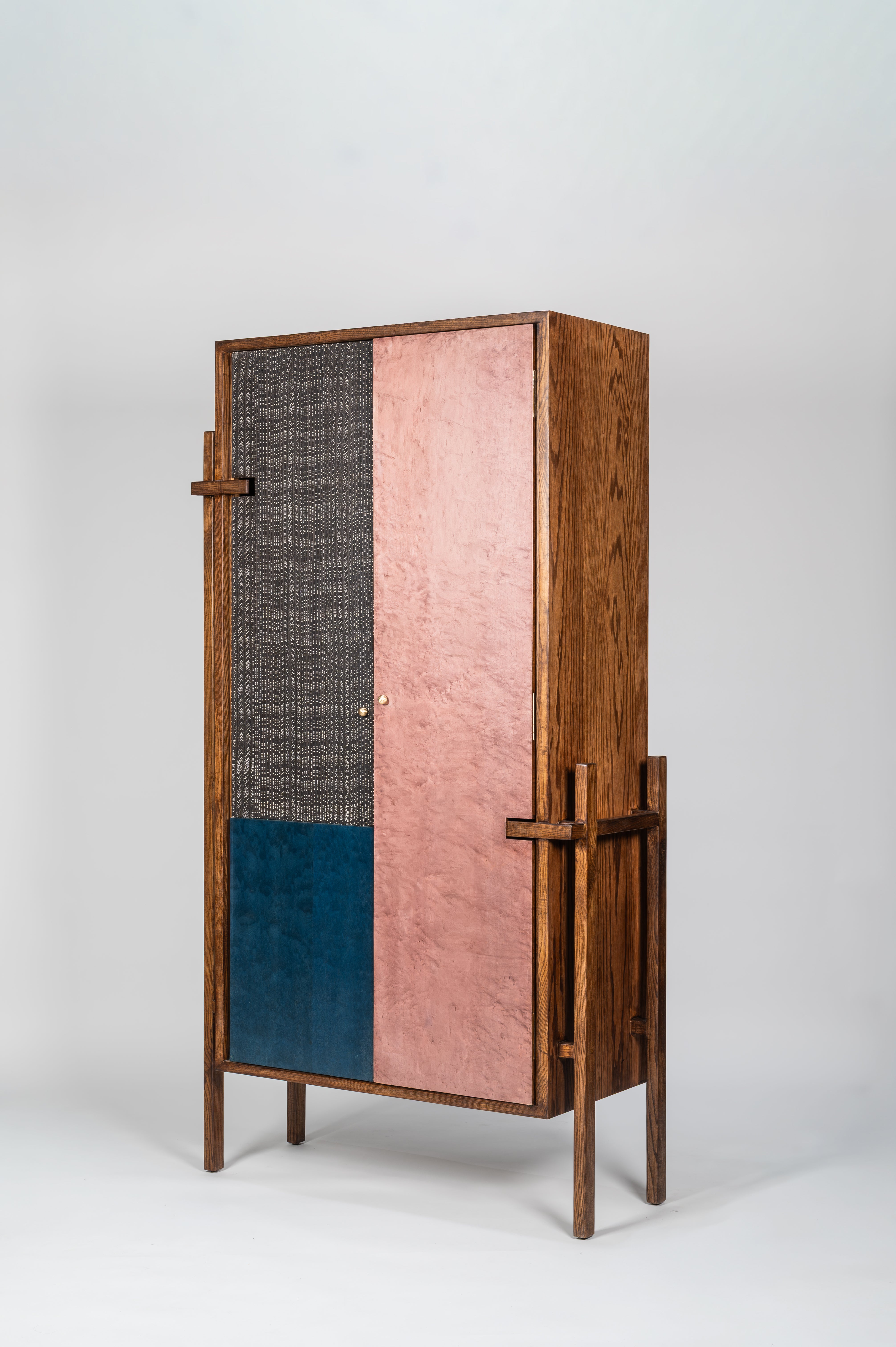 Wooden cabinet with multicolored doors on a white background