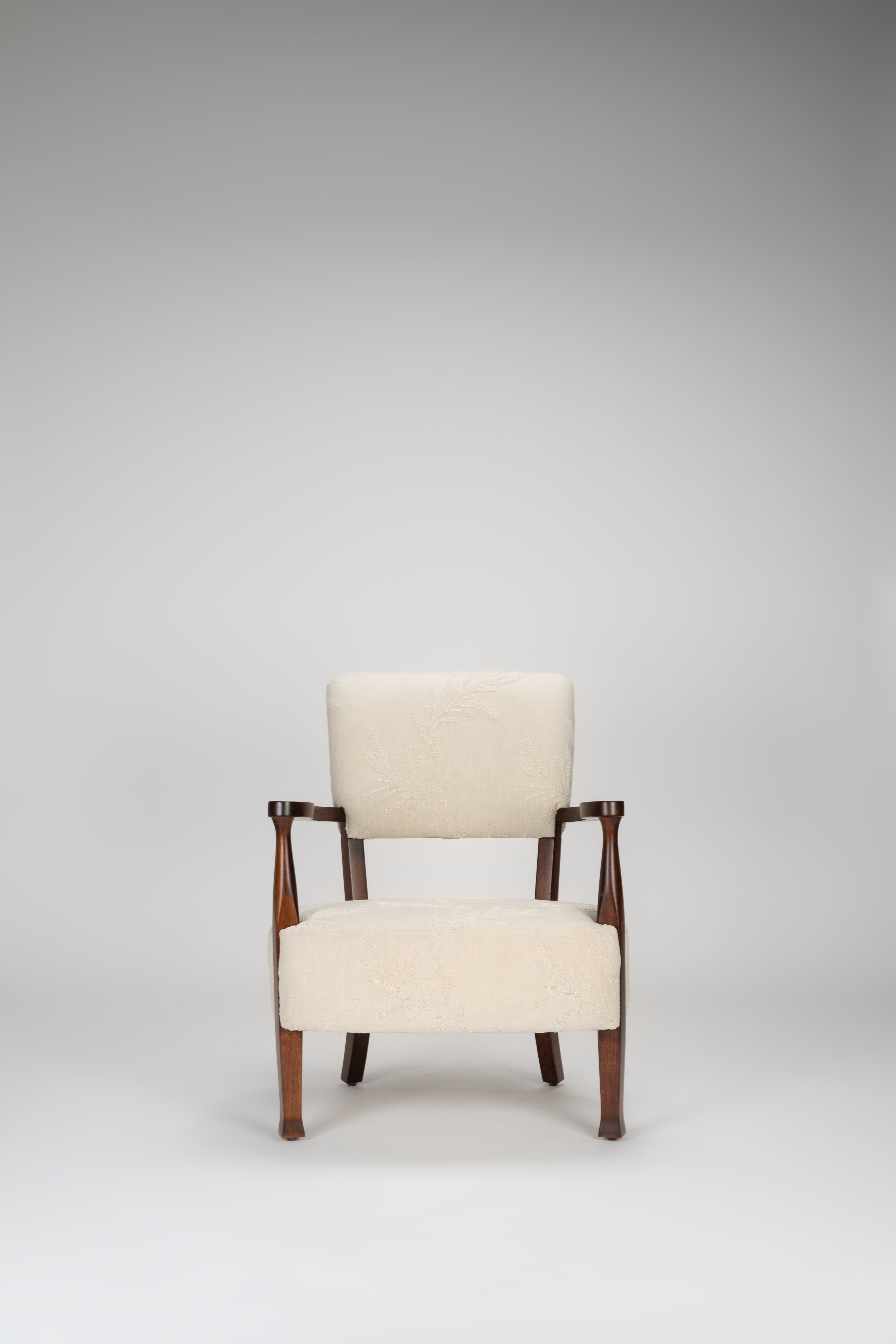 Chair with wooden frame and cream upholstery on a gray background