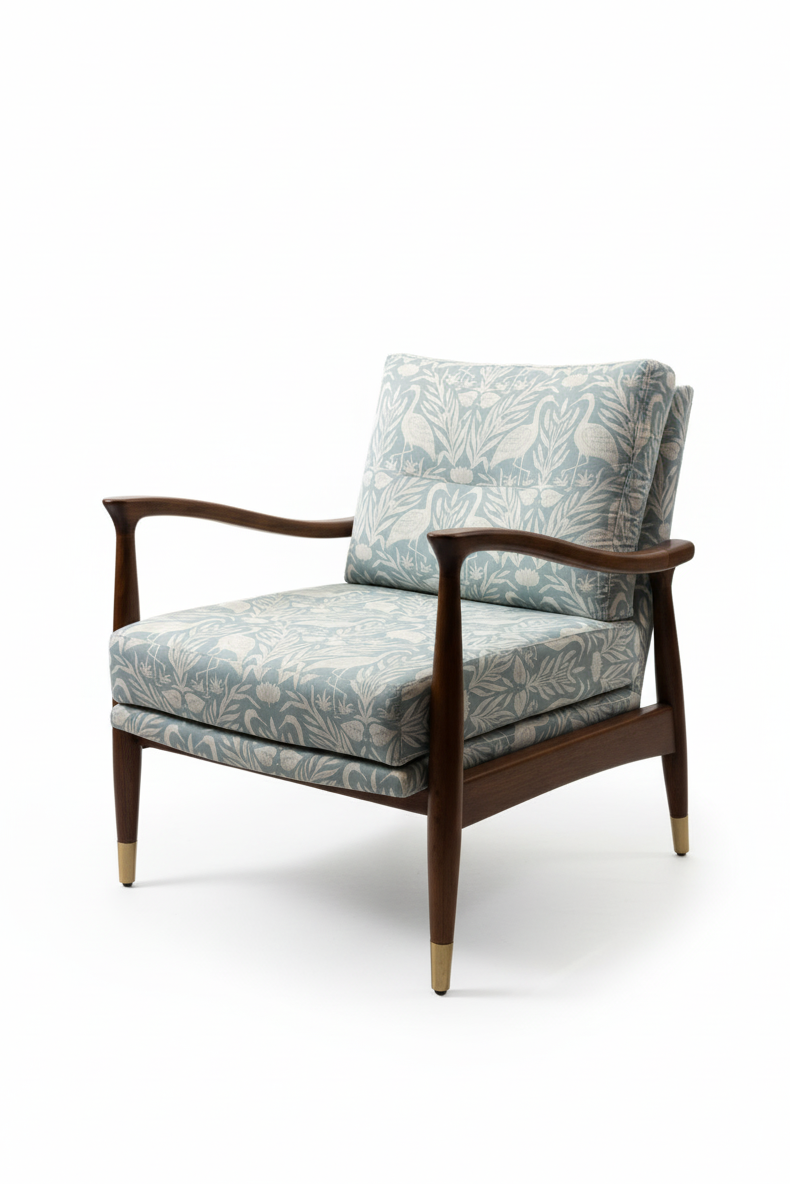 Chair with floral patterned fabric and wooden frame on a white background