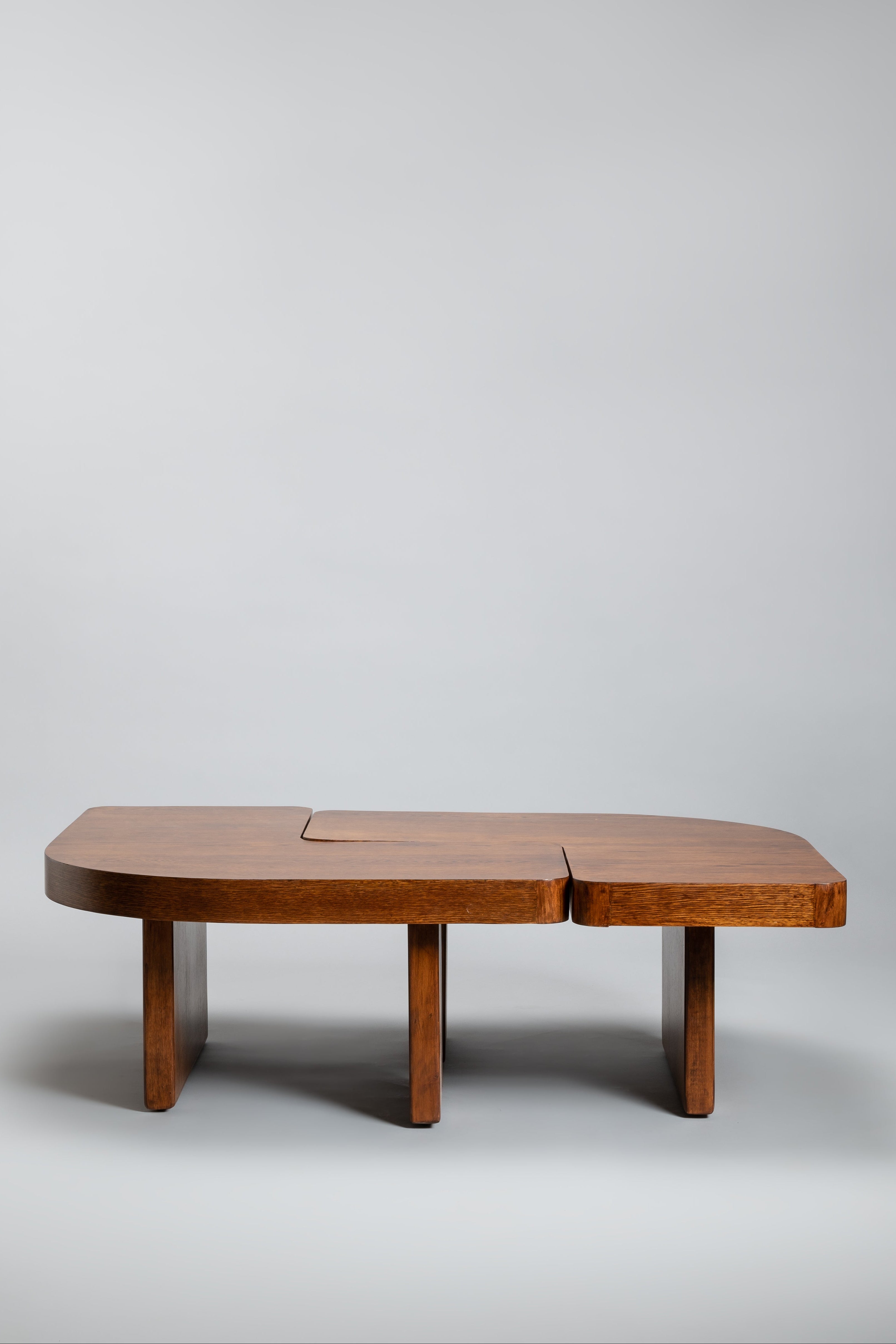 Wooden coffee table on a plain gray background