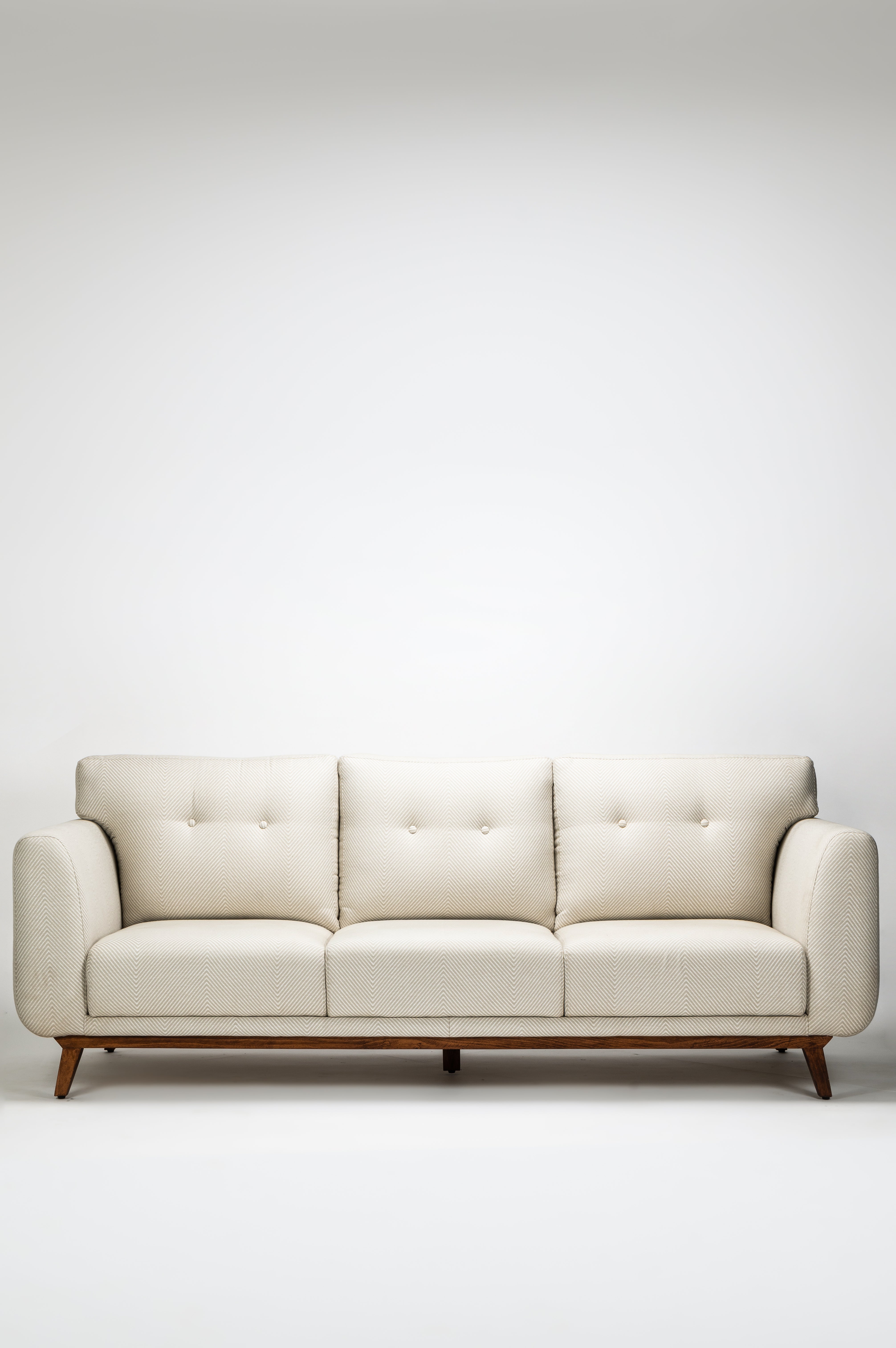 Beige sofa on a white background