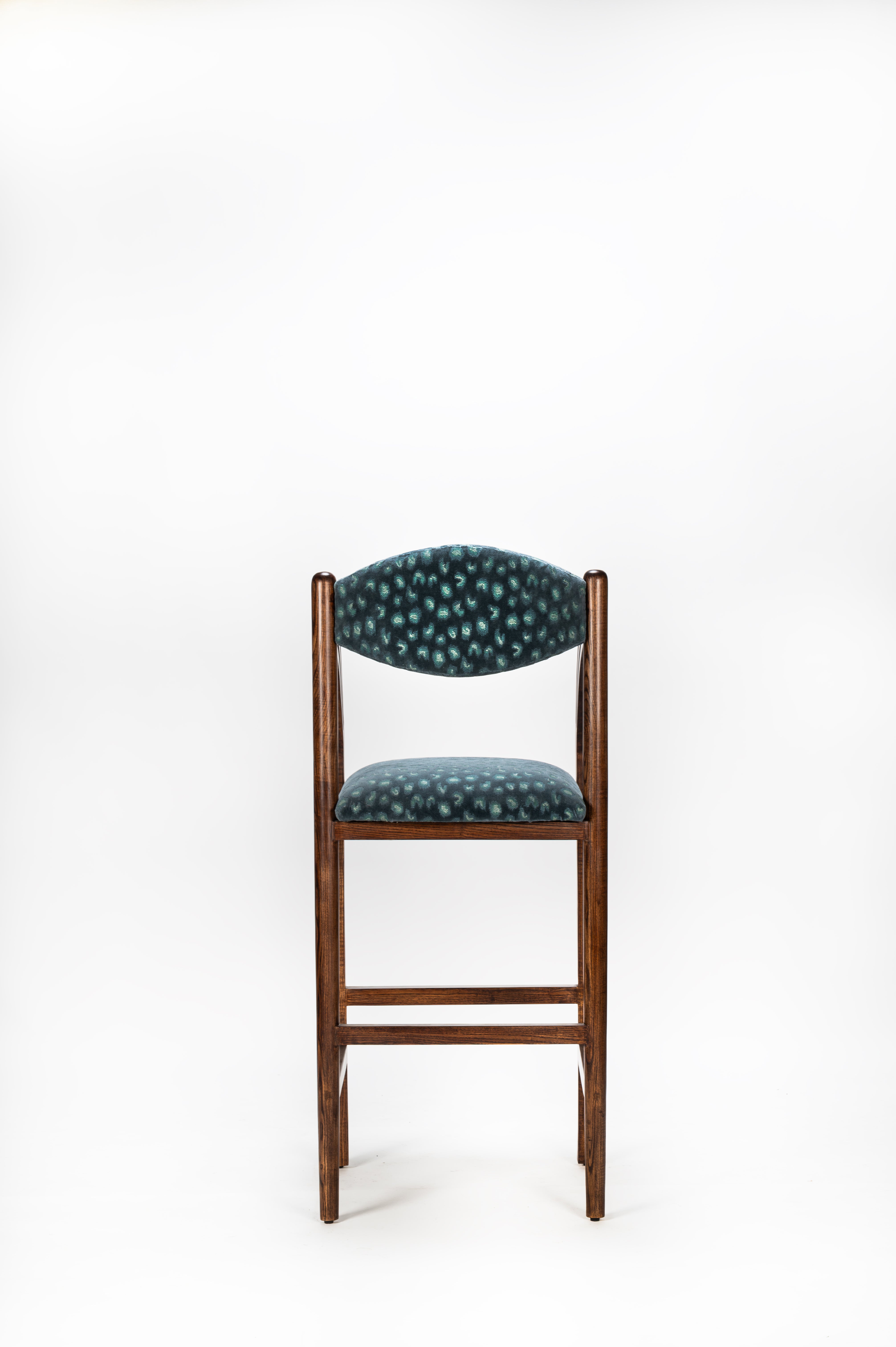 Chair with patterned cushion on a white background
