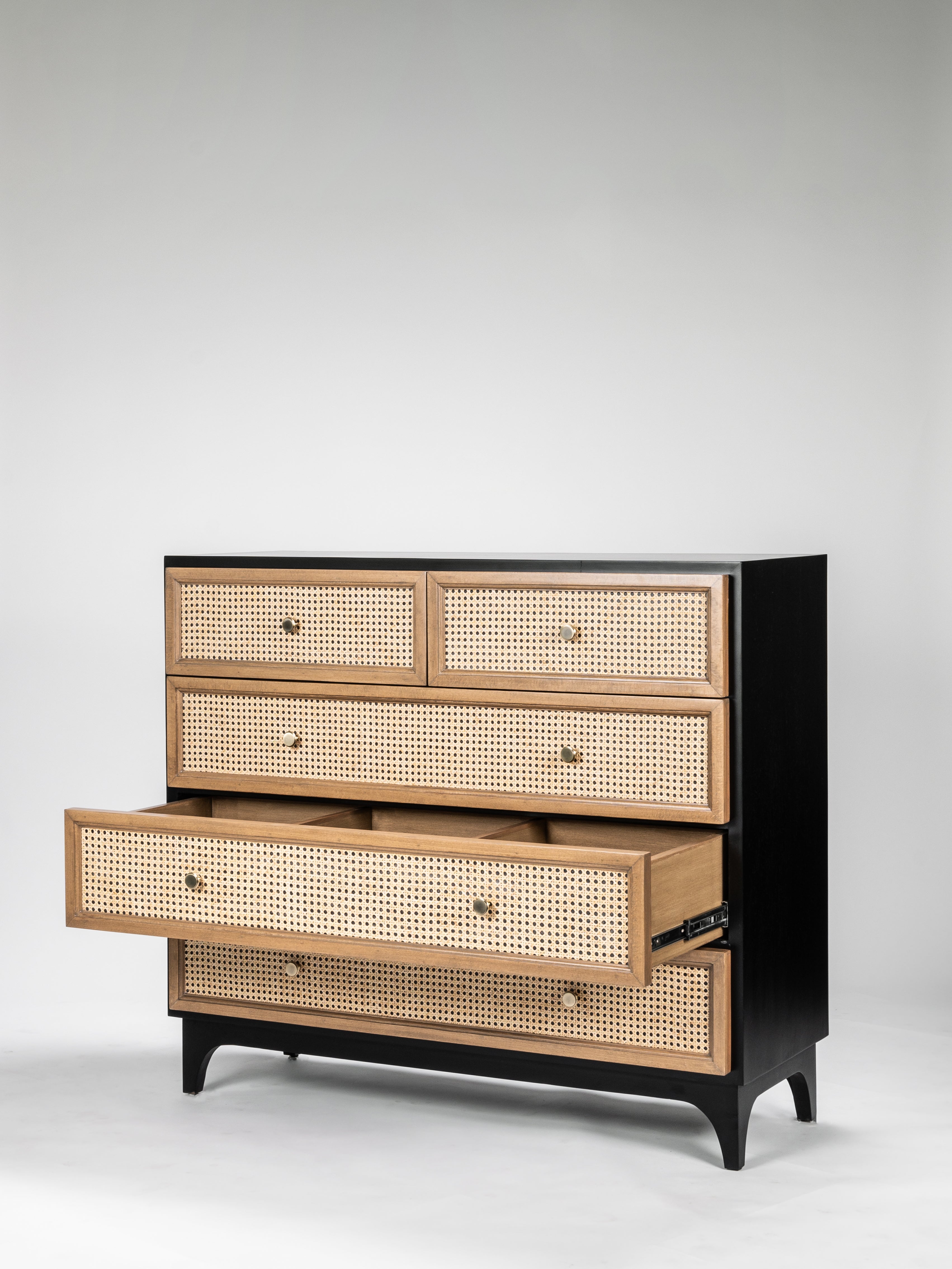 Wooden dresser with wicker accents on a gray background