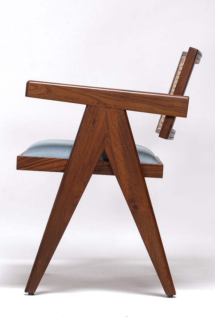 Wooden chair with a light blue cushion on a white background