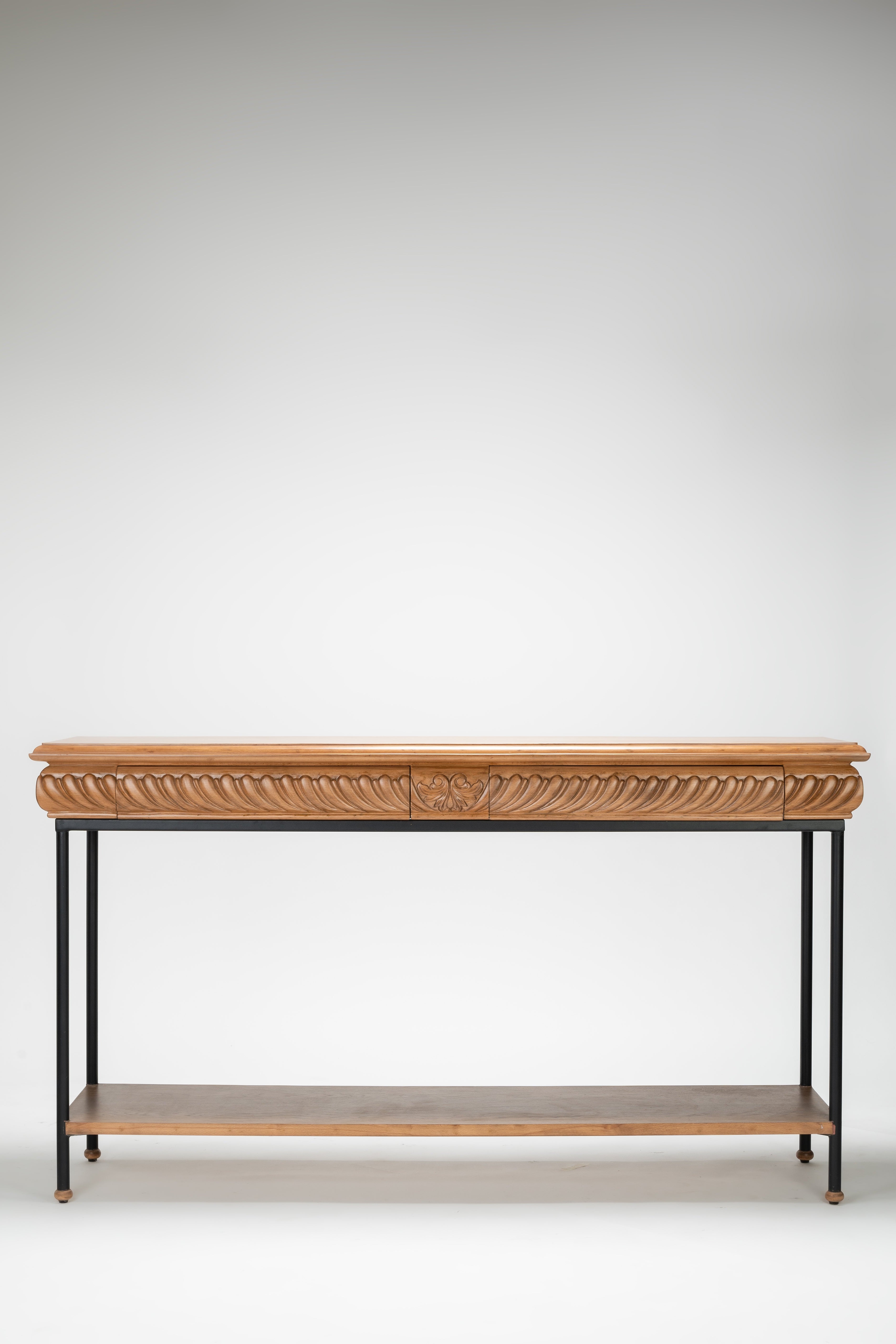 Wooden console table with decorative carvings on a white background