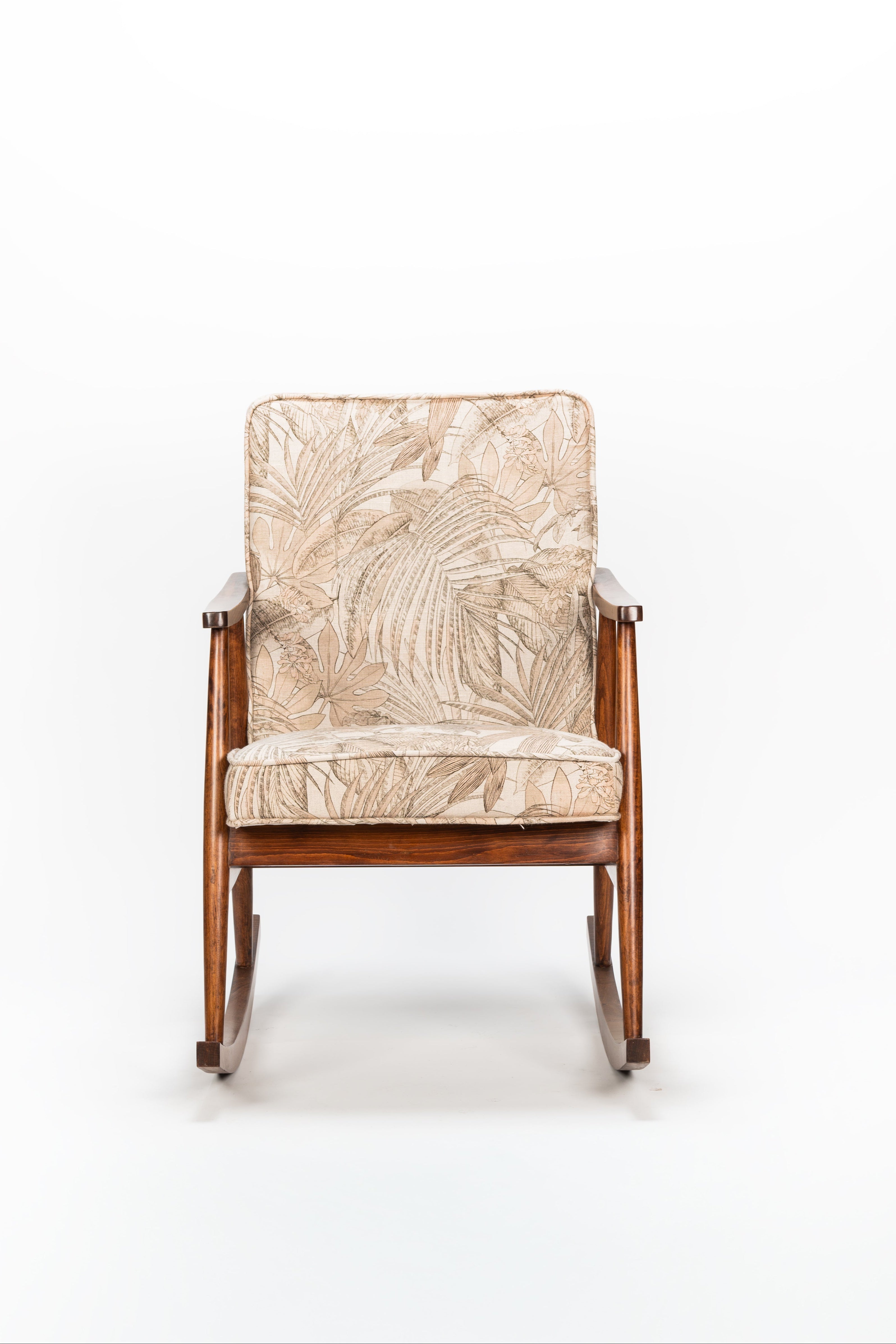 Chair with floral patterned cushion on a white background