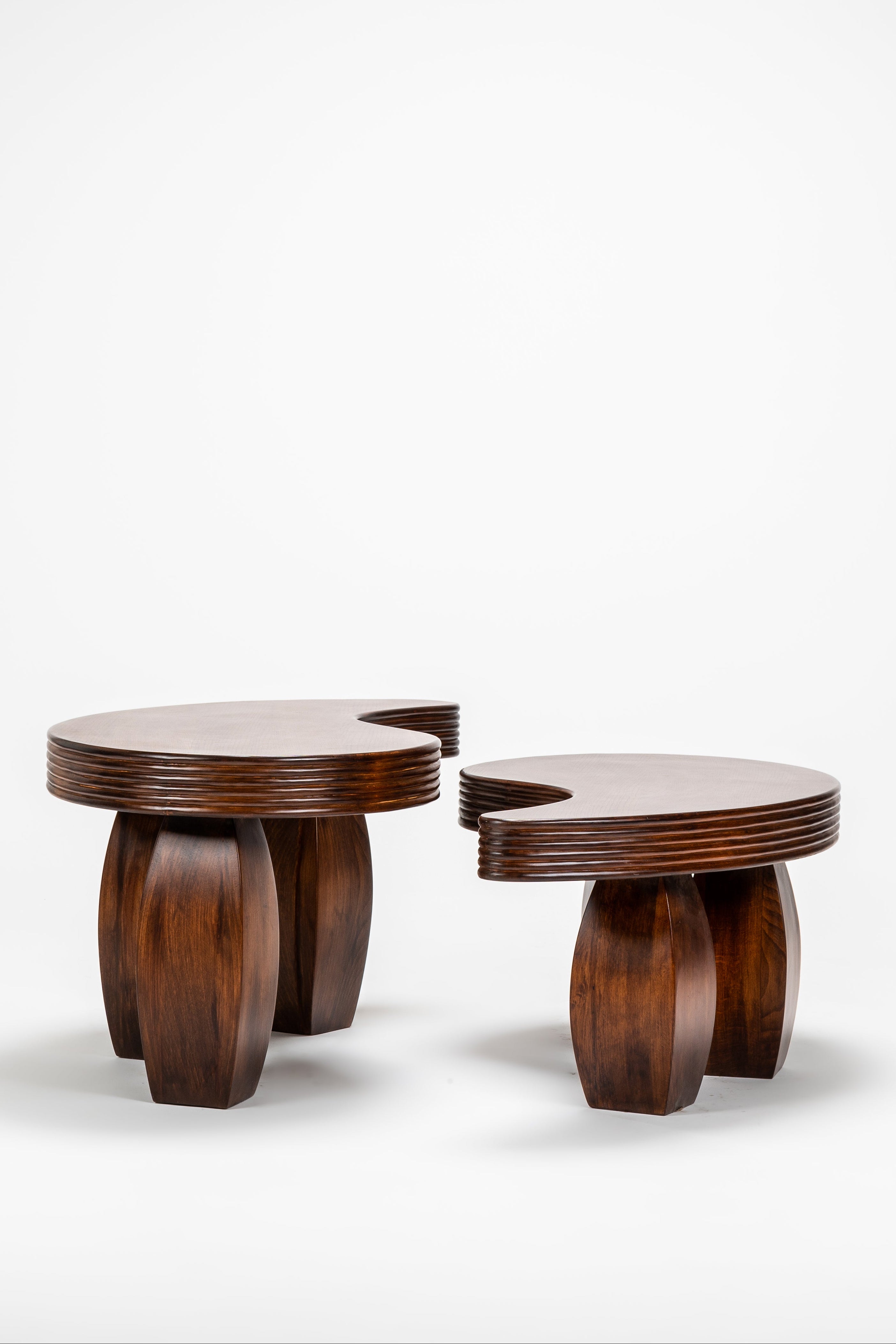 Two wooden tables with a unique design on a white background