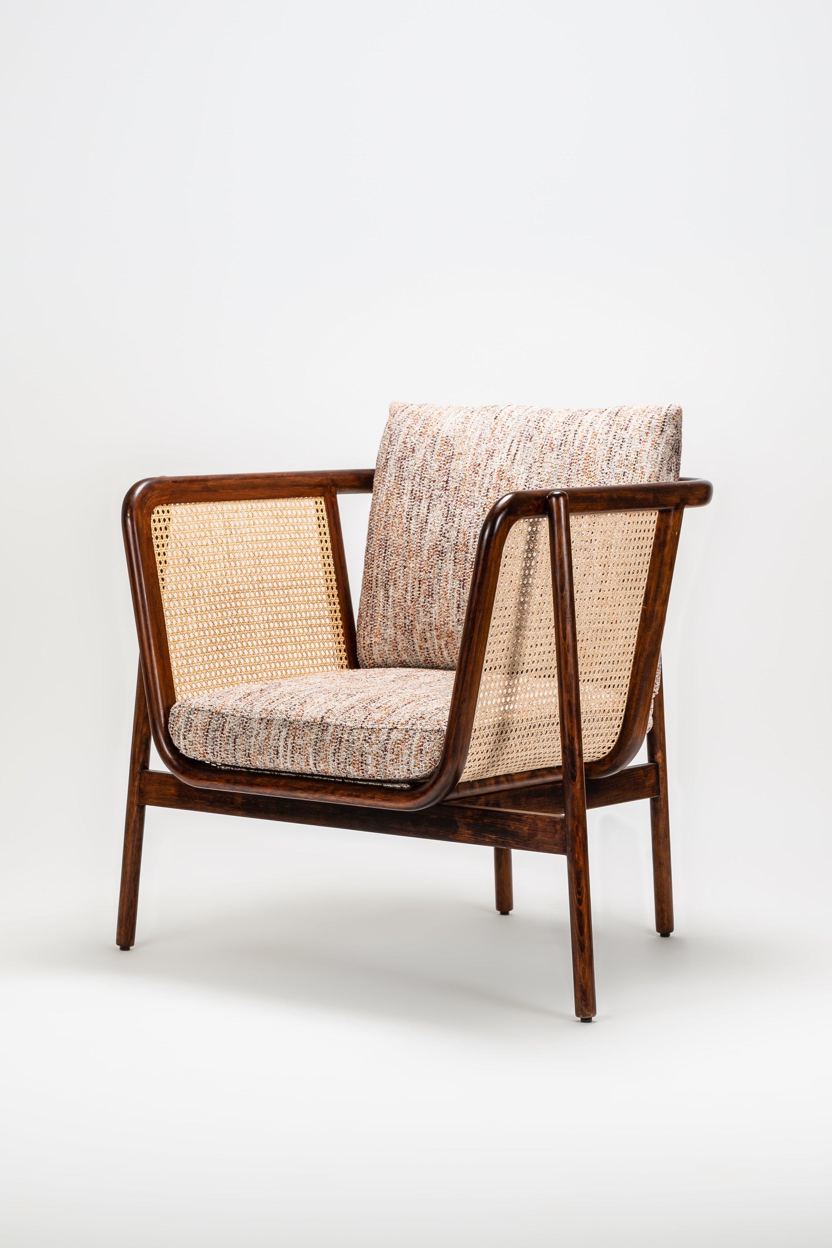Wooden armchair with woven backrest on a white background
