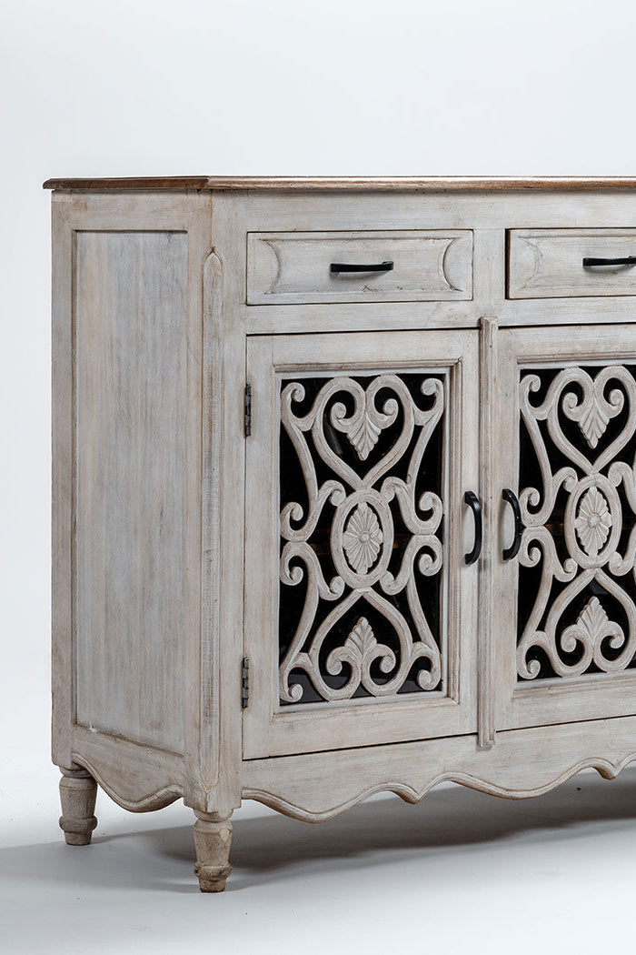 Wooden sideboard with decorative patterns on a white background