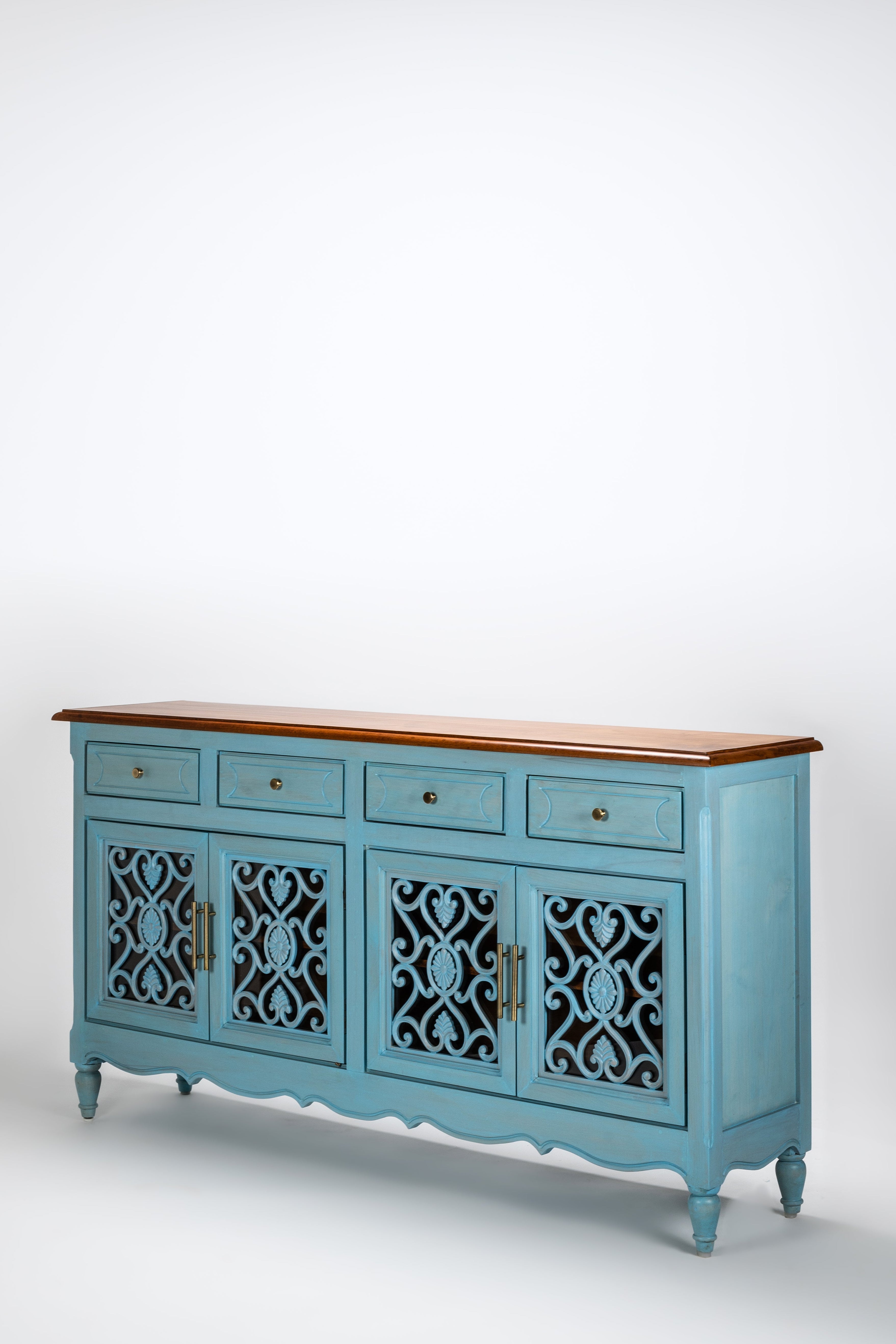 Blue sideboard with decorative cut-out panels on a white background
