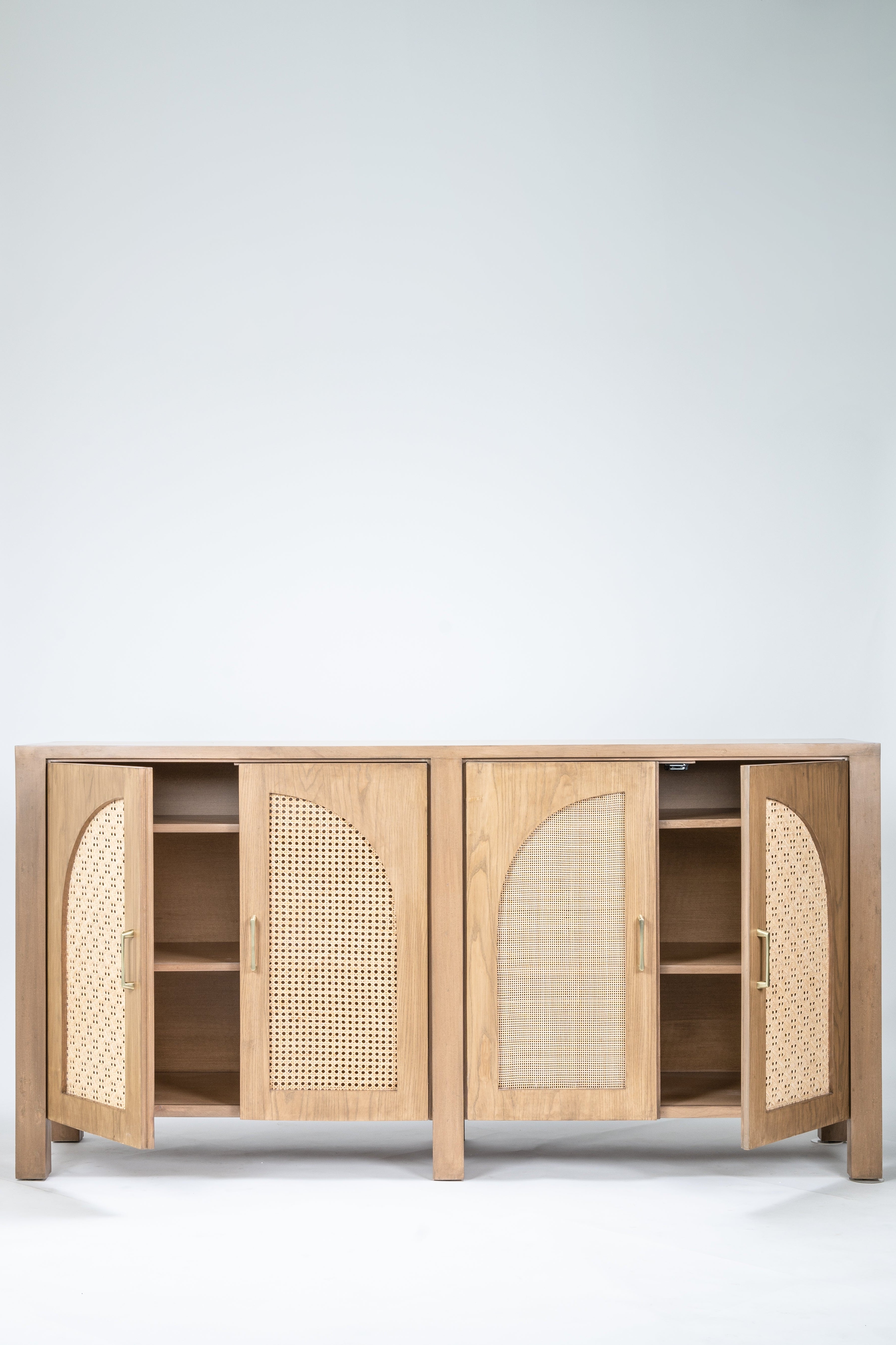 Wooden cabinet with rattan doors on a white background