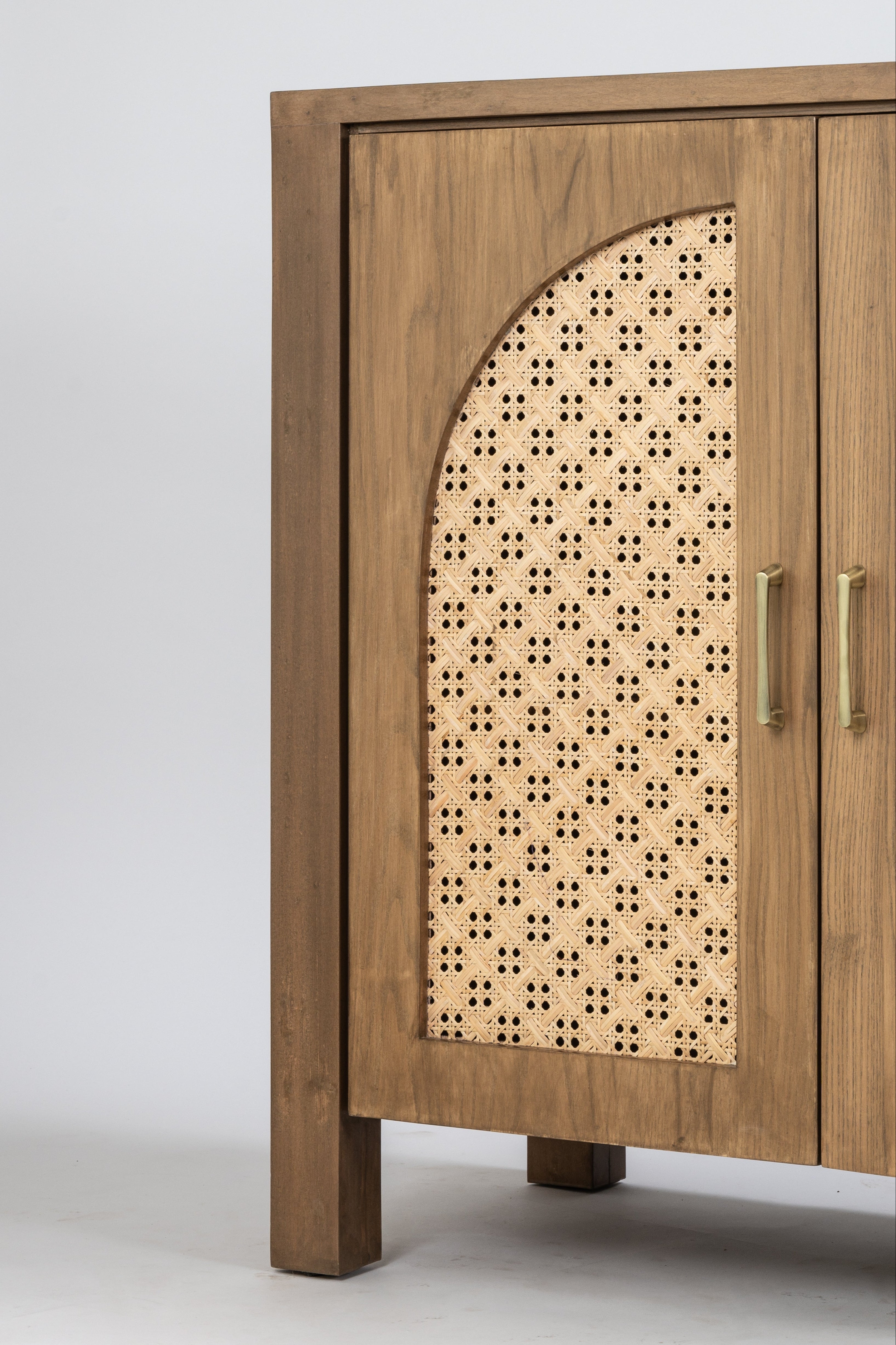 Wooden cabinet with decorative door featuring a geometric pattern on a white background