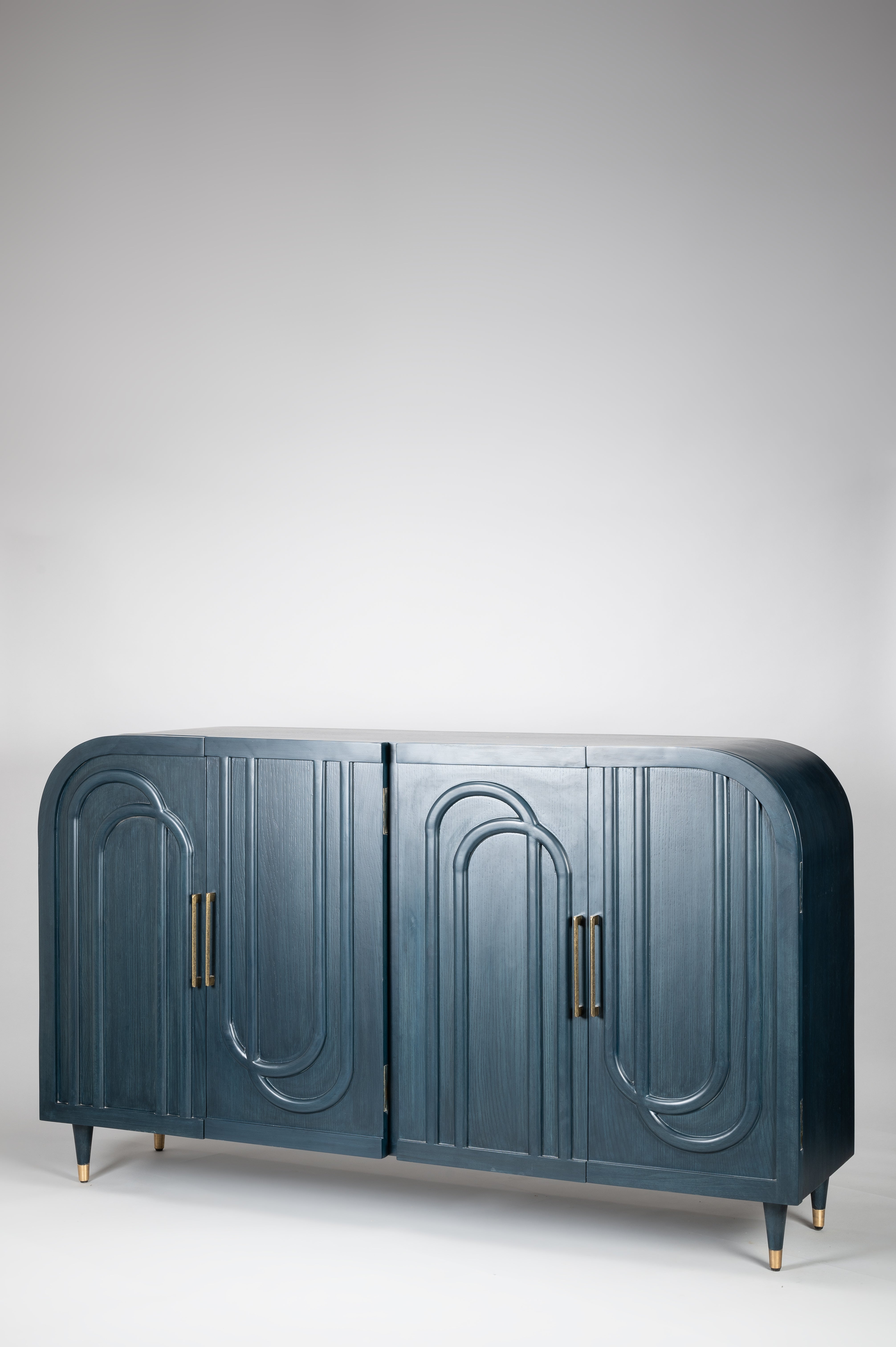 Blue sideboard with decorative arches on a white background