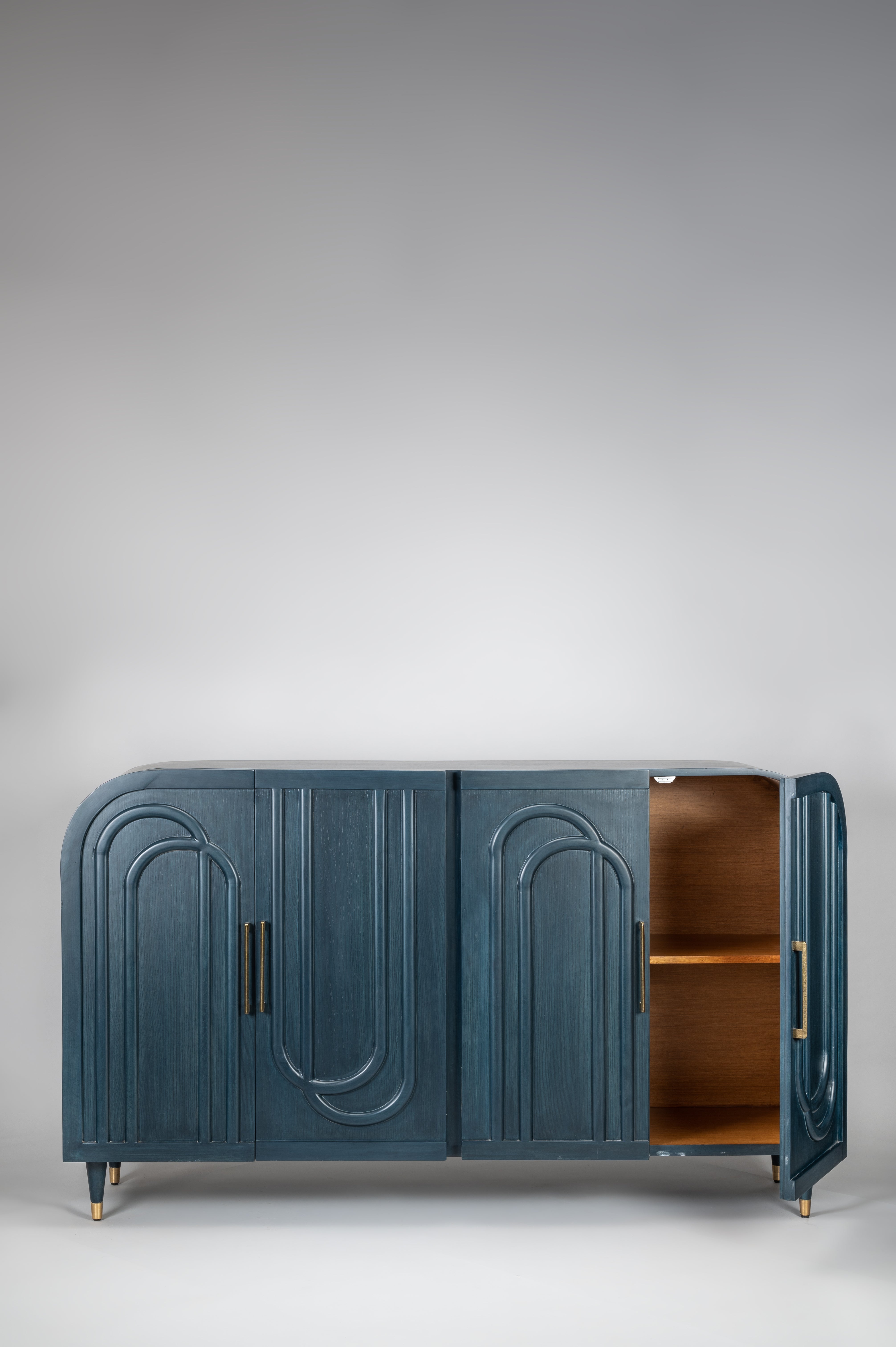 Blue cabinet with arched design on a gray background