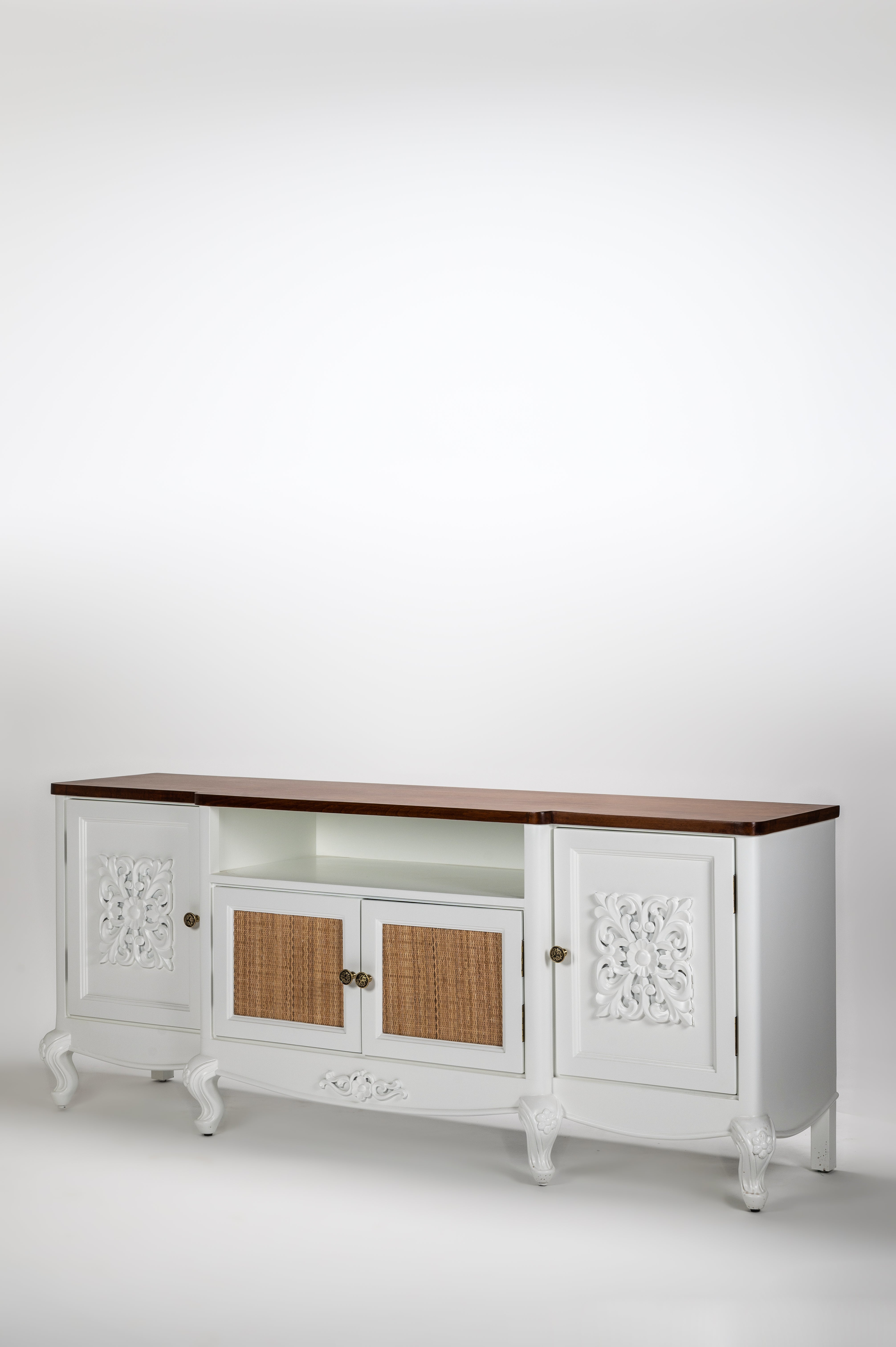 White sideboard with wooden top and decorative elements on a white background