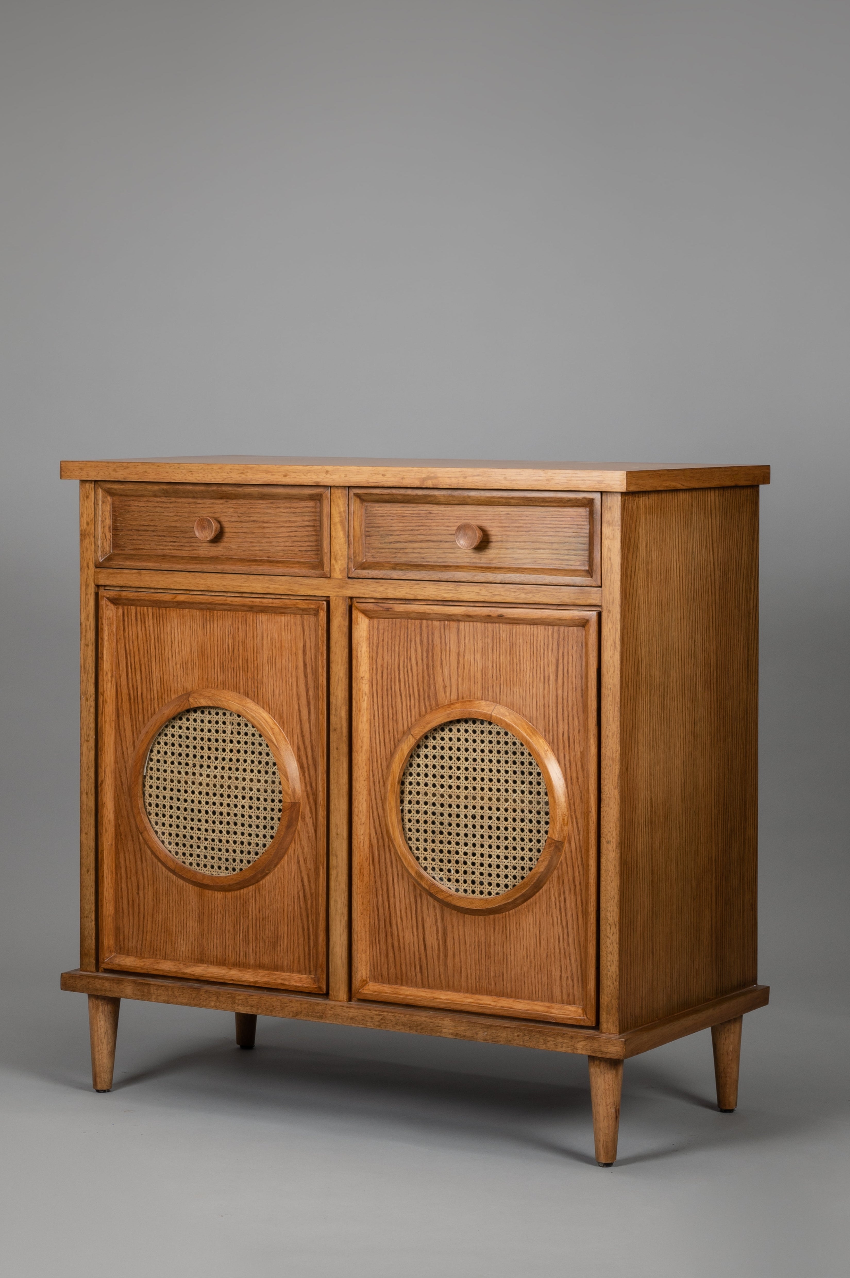 Wooden cabinet with two drawers and two doors on a gray background