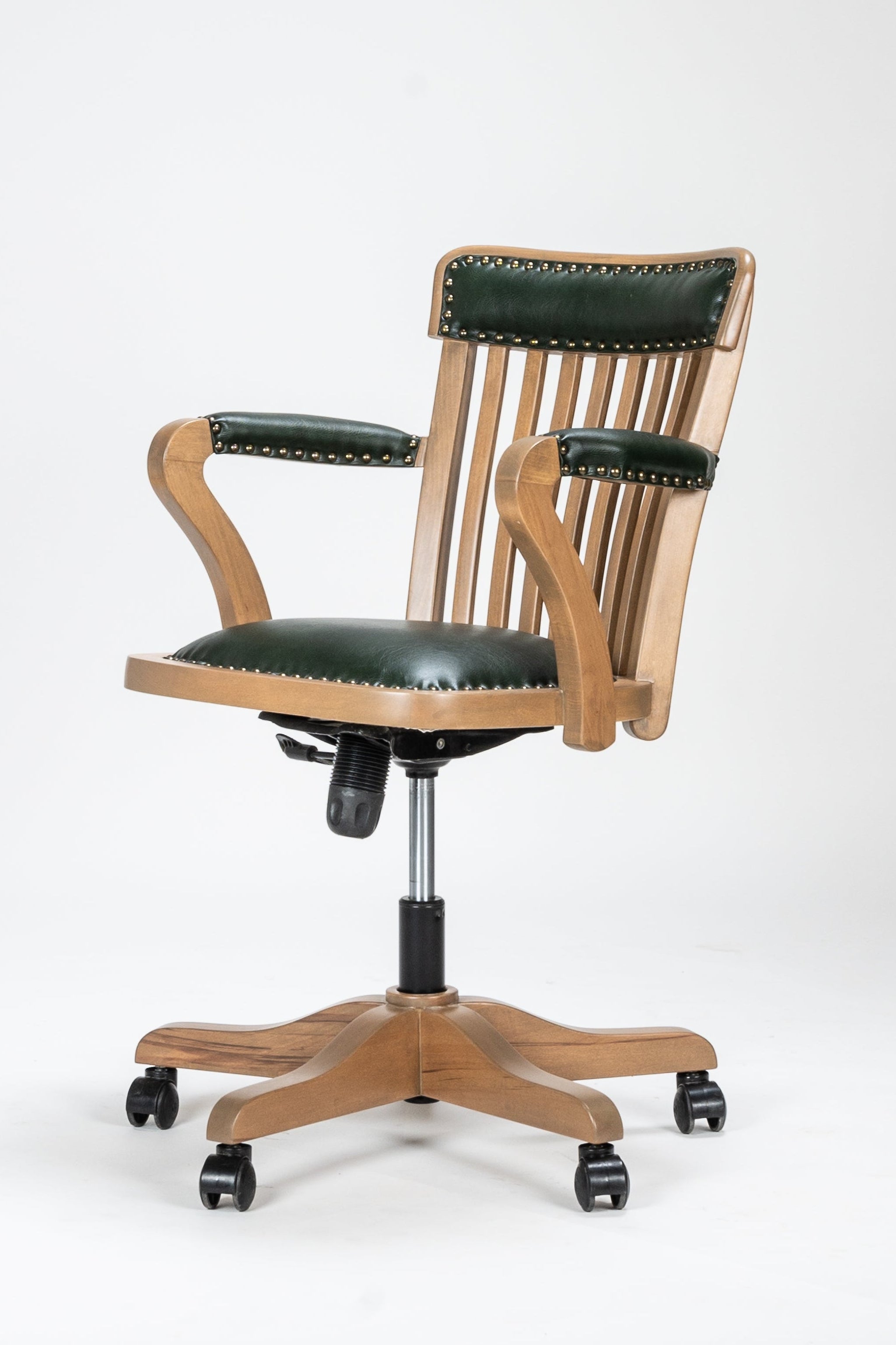 Wooden office chair with green leather seat and backrest on a white background