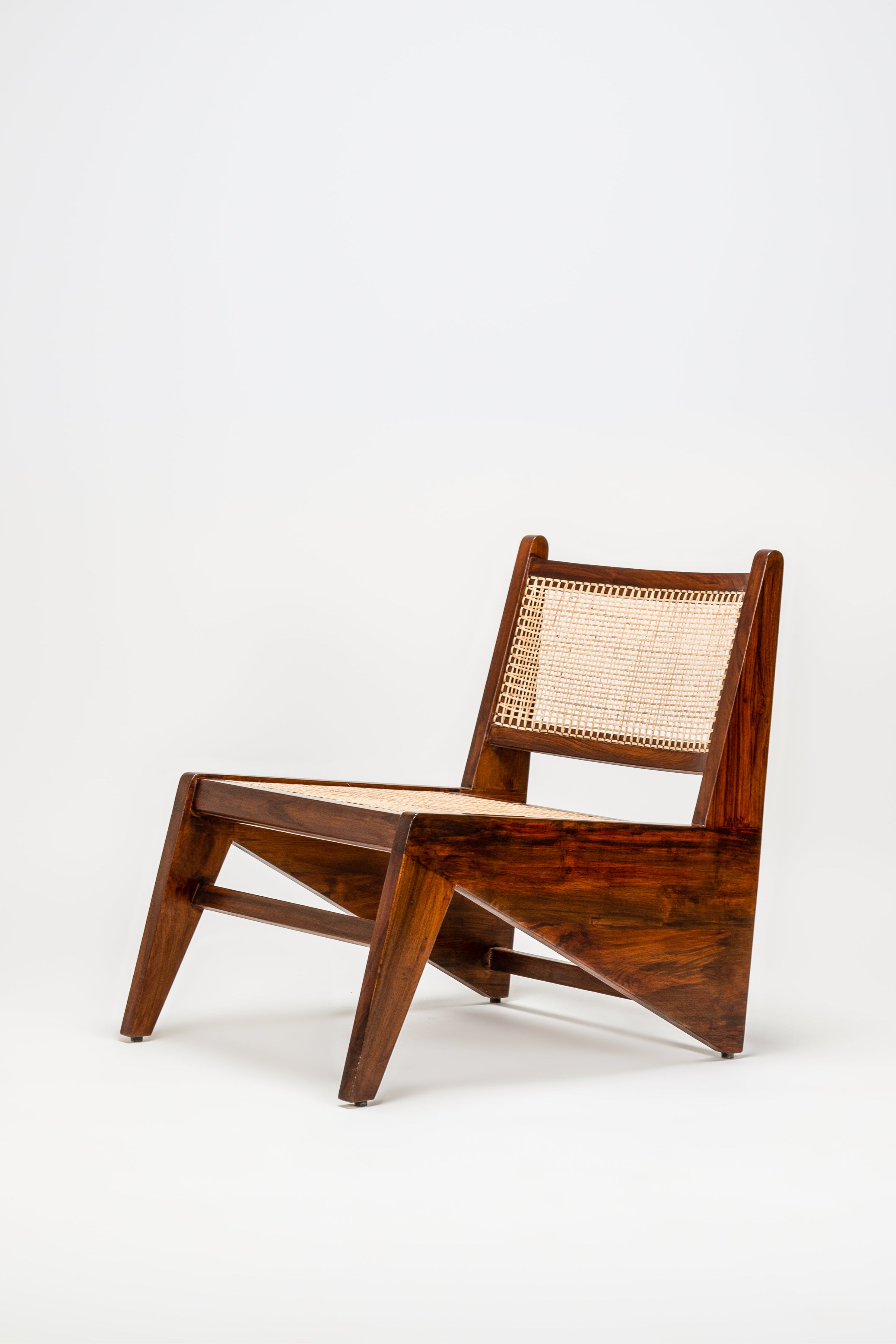 Wooden chair with wicker backrest on a white background