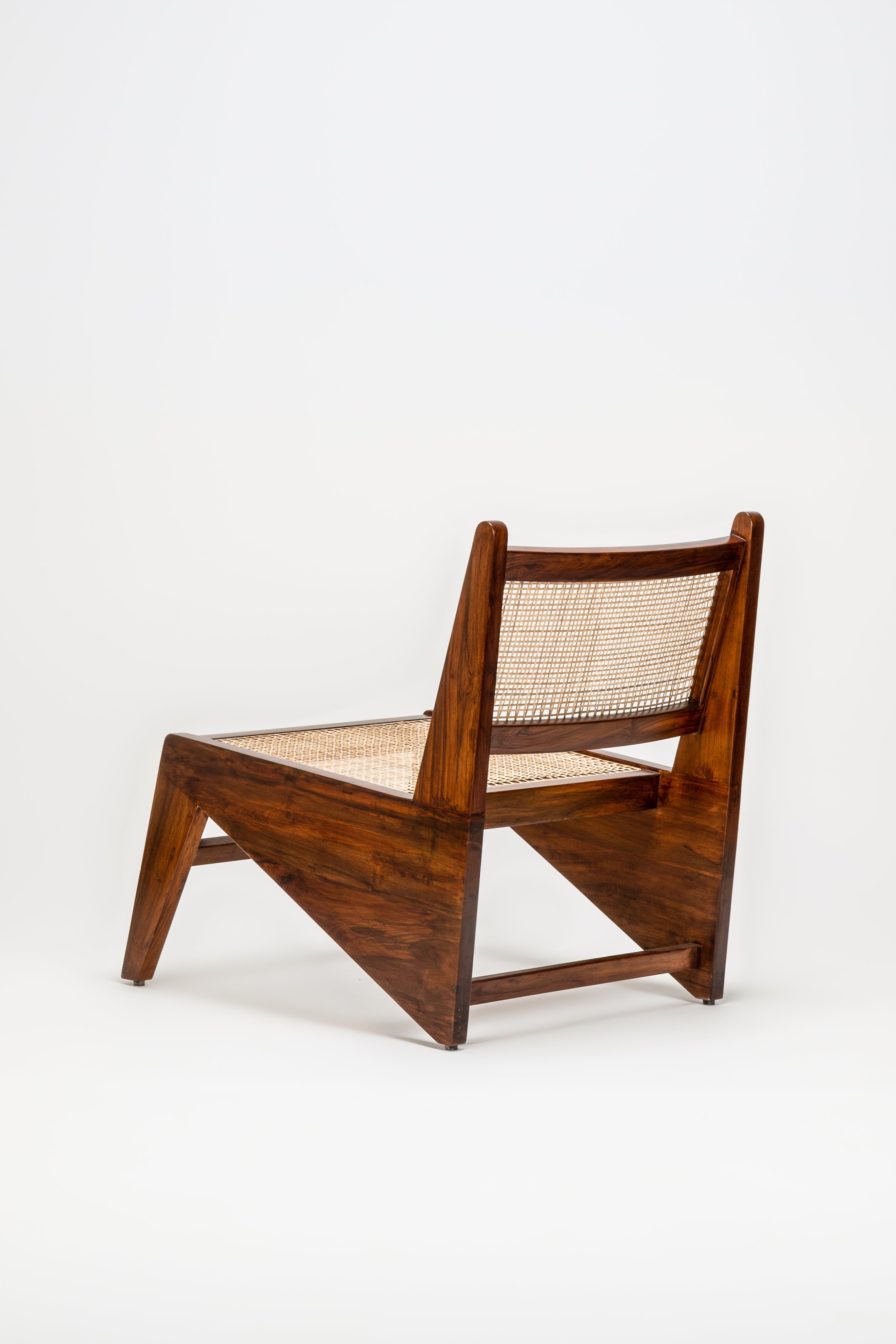 Wooden chair with woven seat on a white background