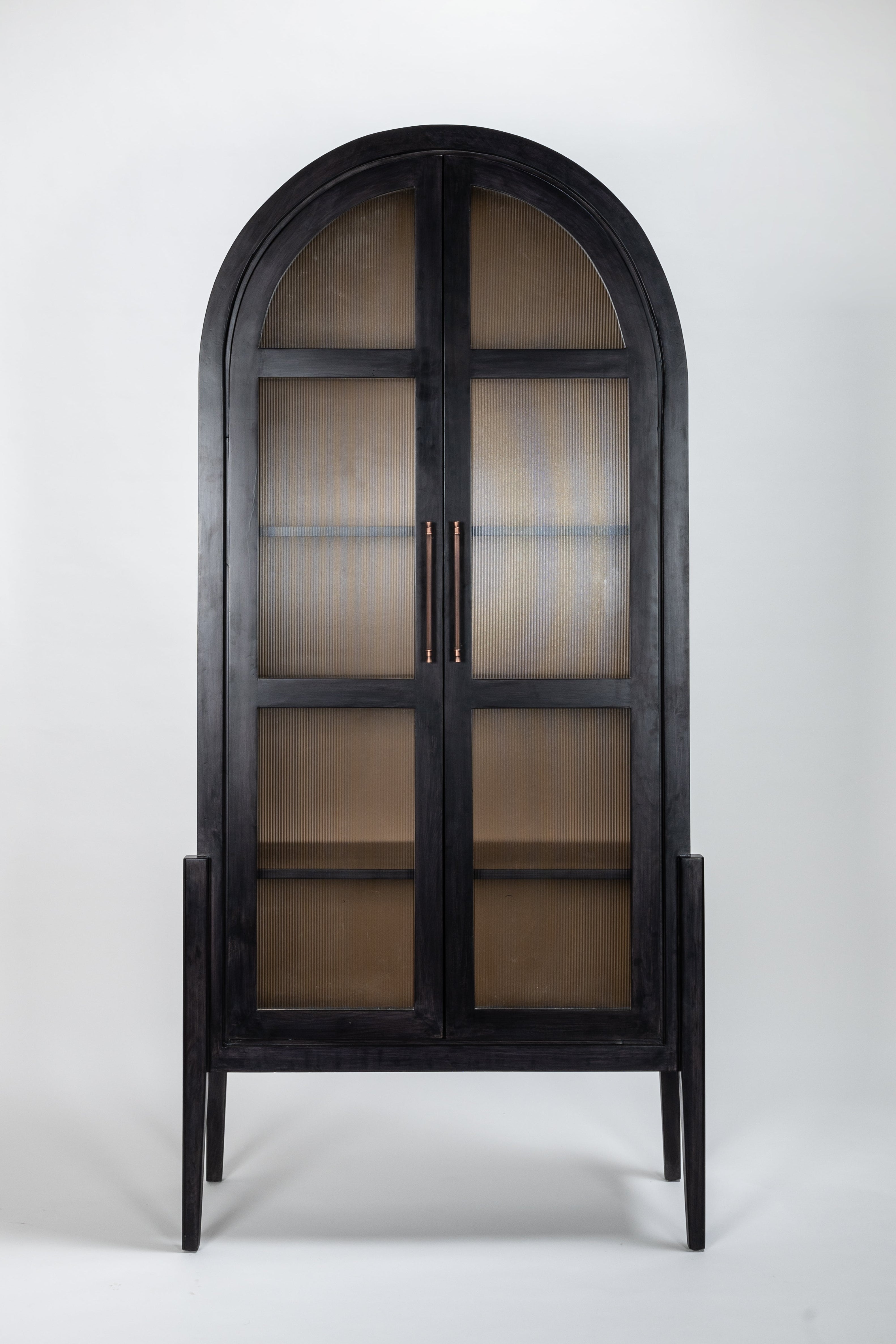 Black arched cabinet with glass panels on a white background