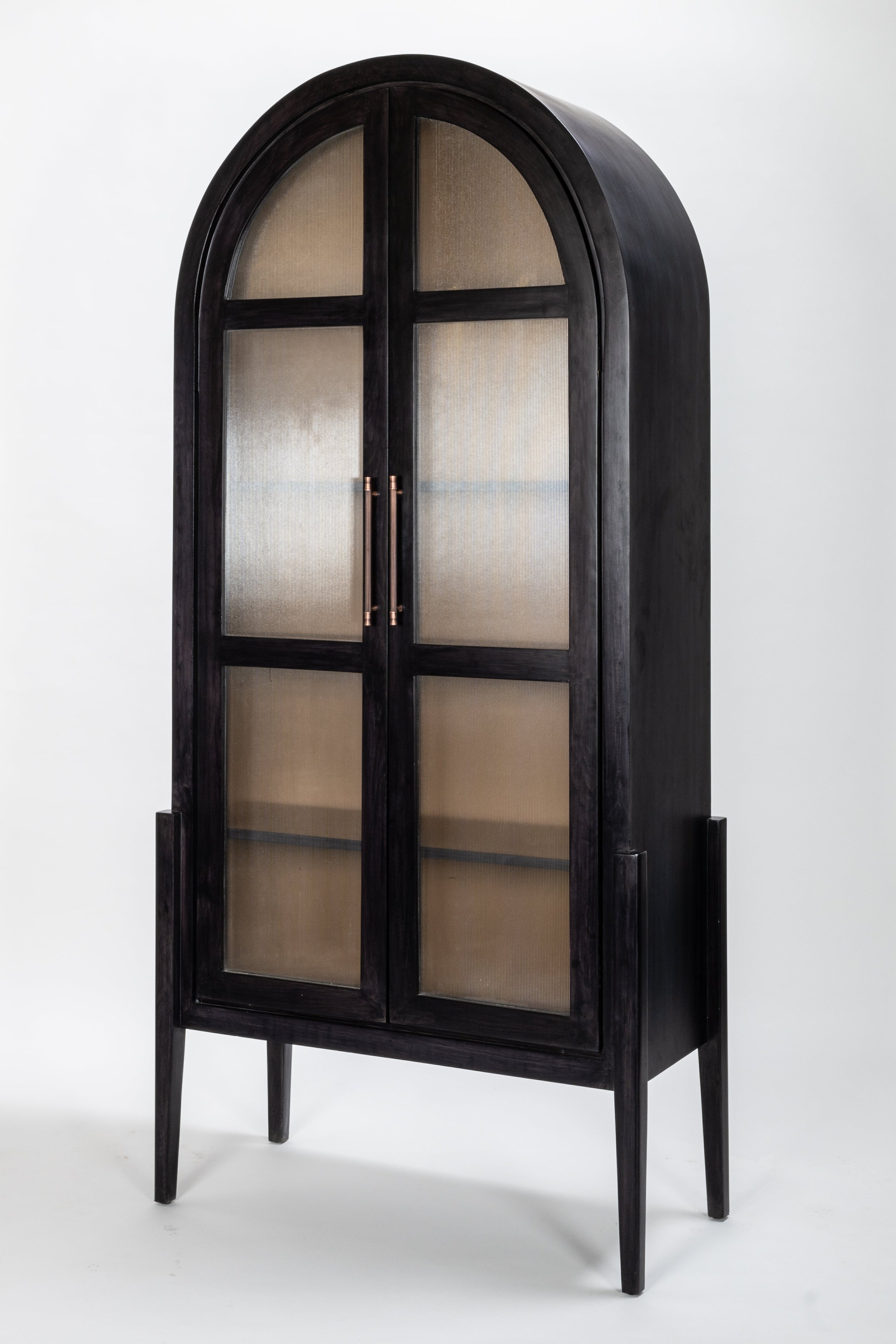 Black arched cabinet with glass doors on a white background