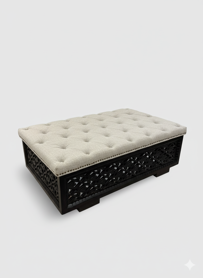 Decorative ottoman with tufted cushion on a white background