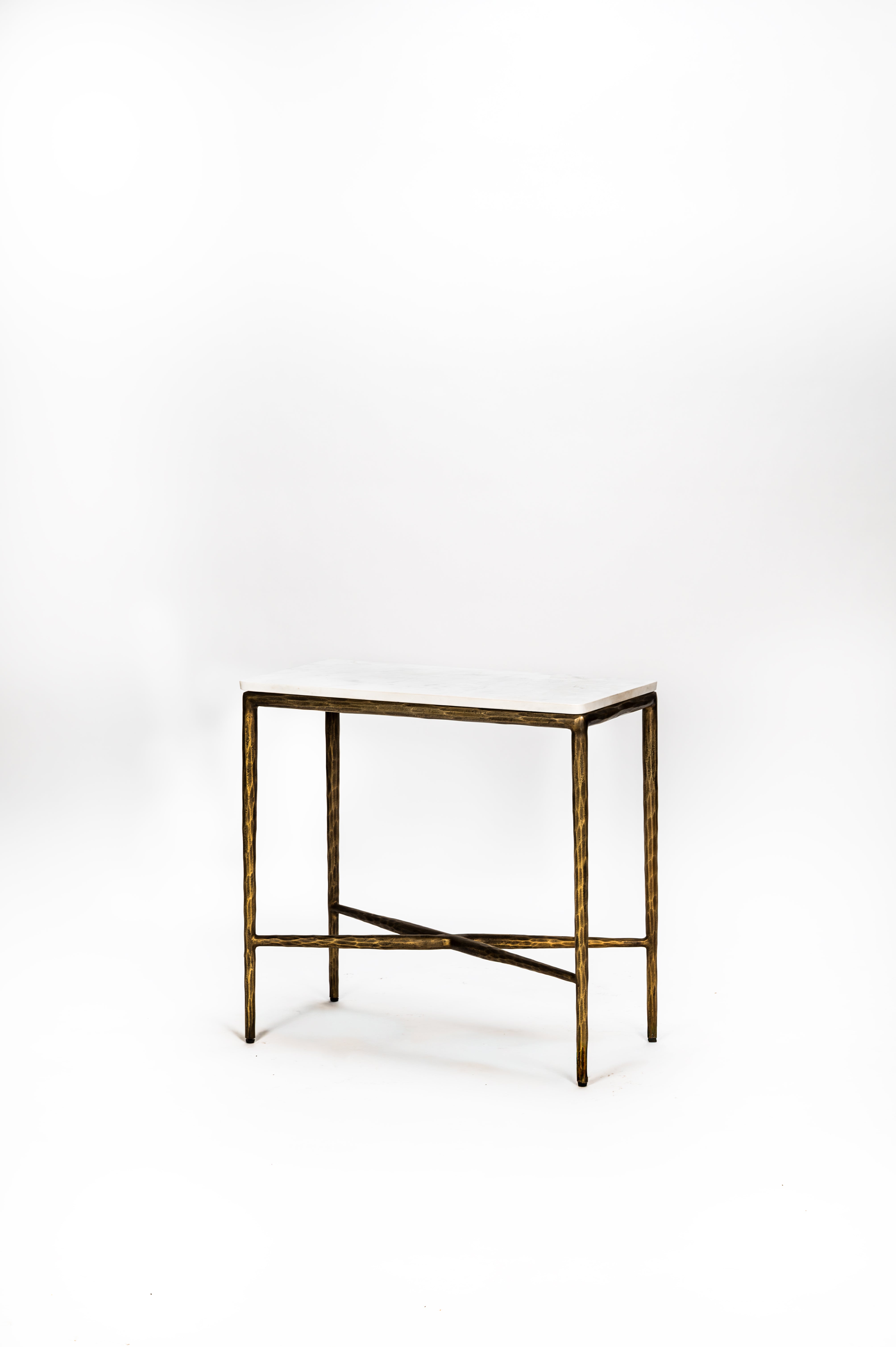 Bronze side table on a white background