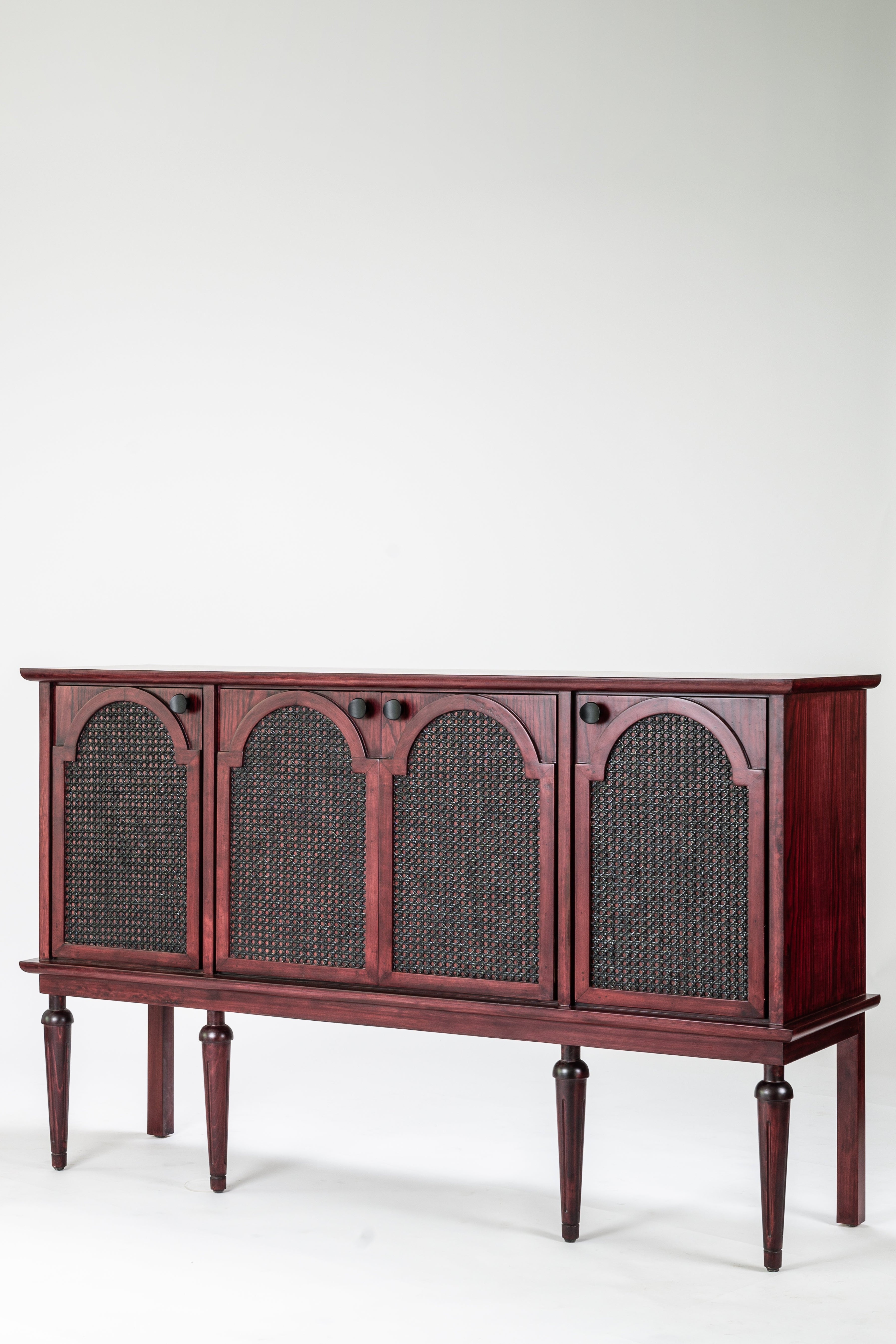 Wooden sideboard with wicker panels on a white background