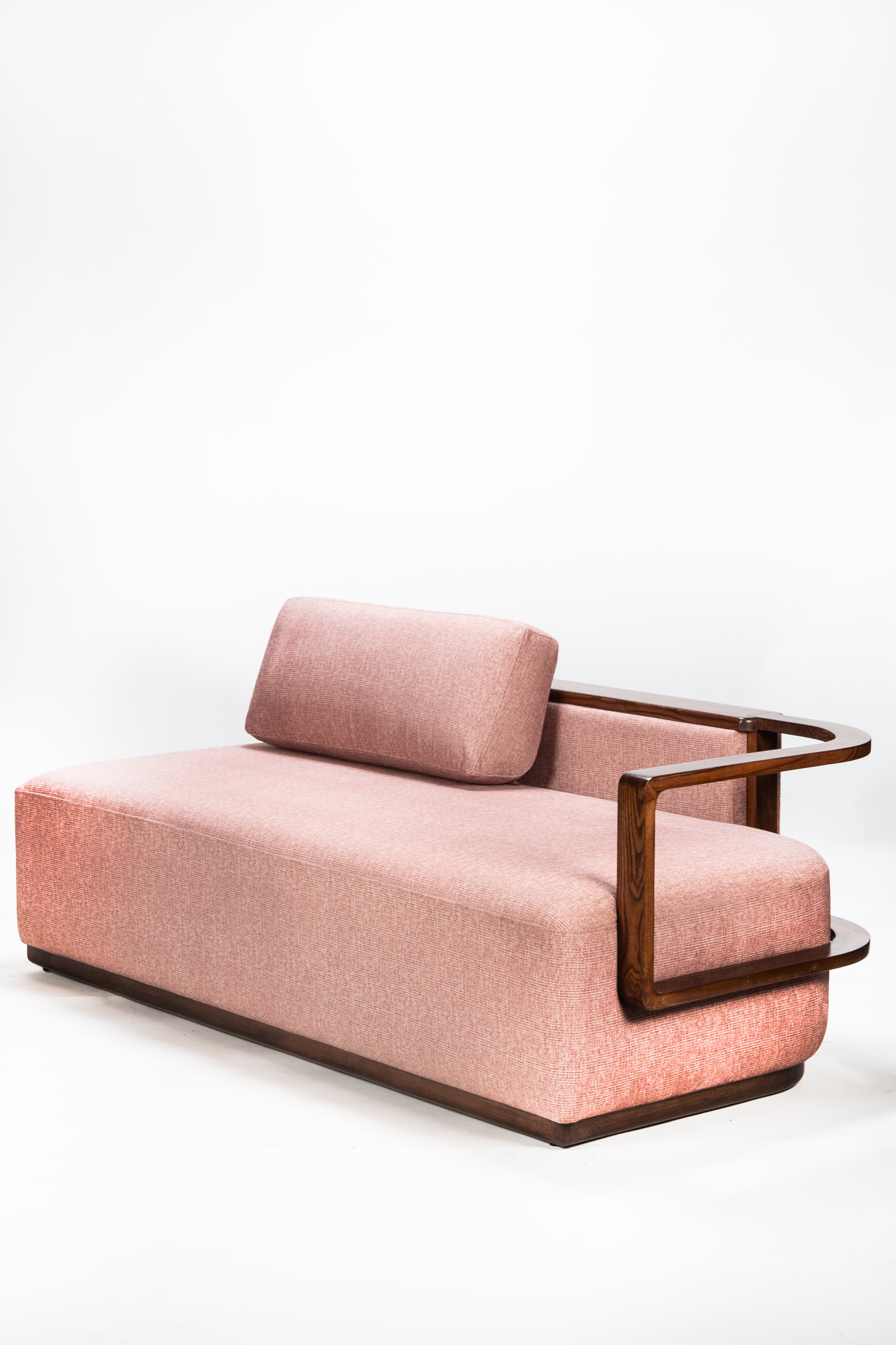 Pink sofa with wooden frame on a white background