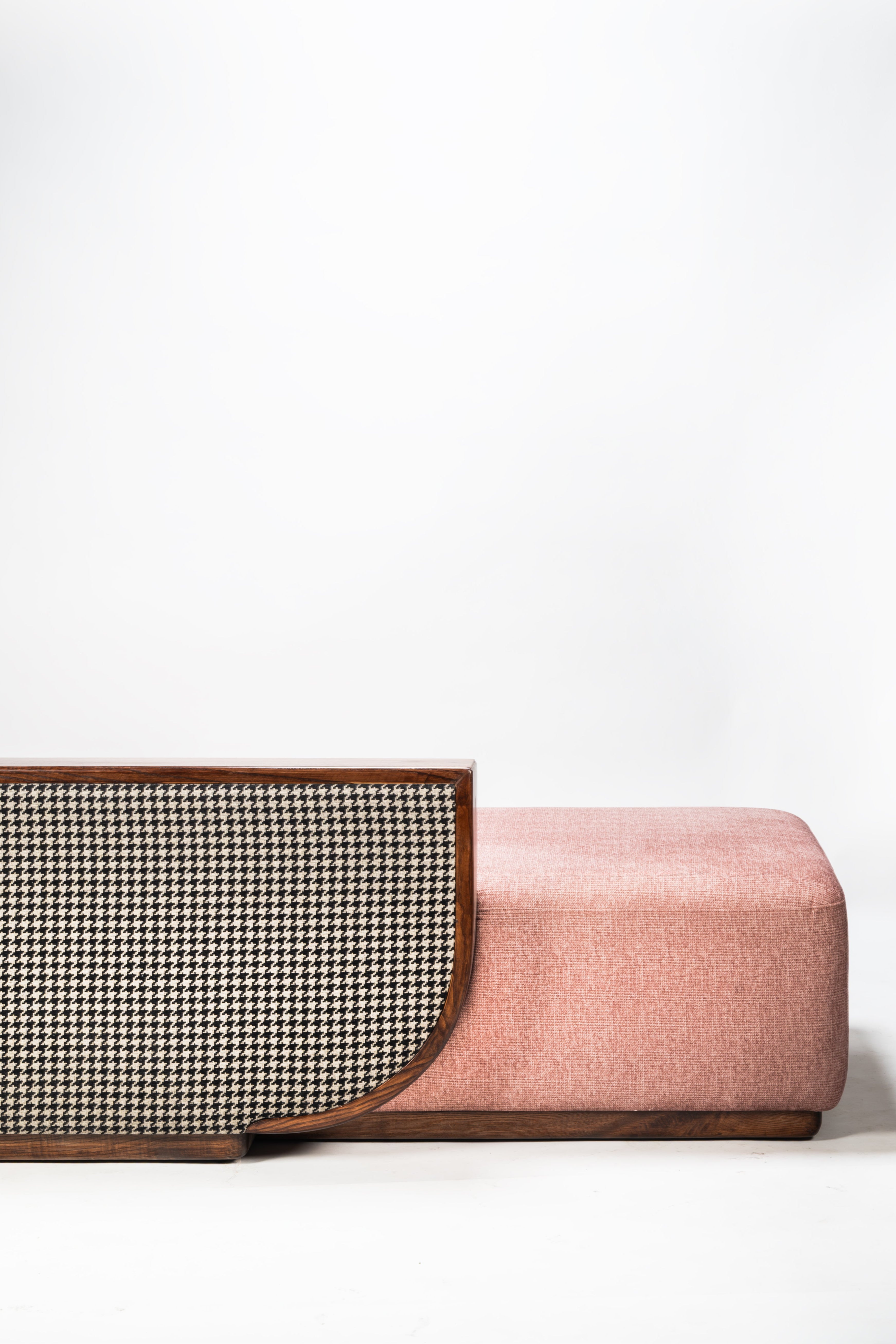 Pink sofa with a textured backrest on a white background
