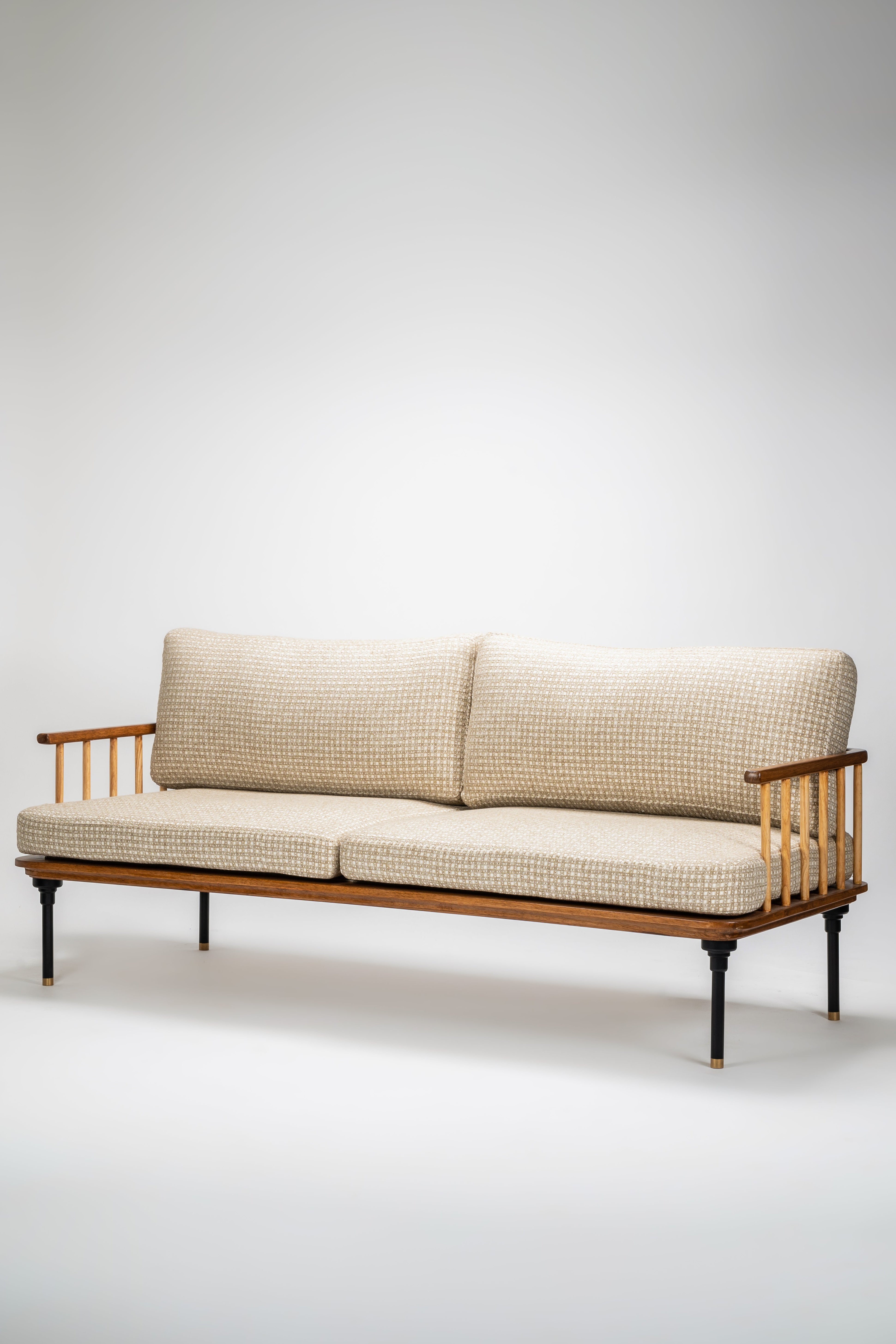 Beige sofa with wooden frame on a white background