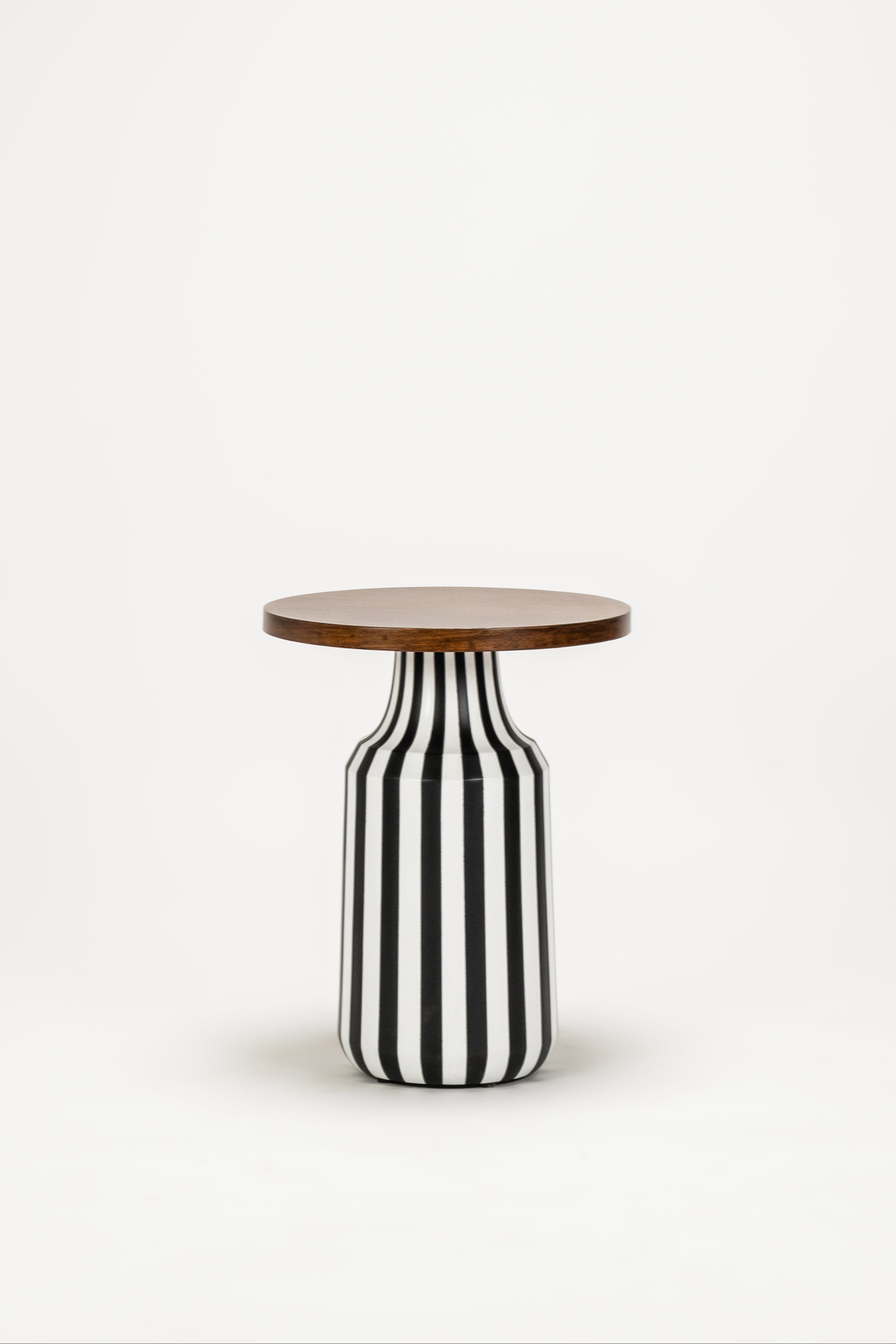Small side table with black and white striped base and wooden top on a white background