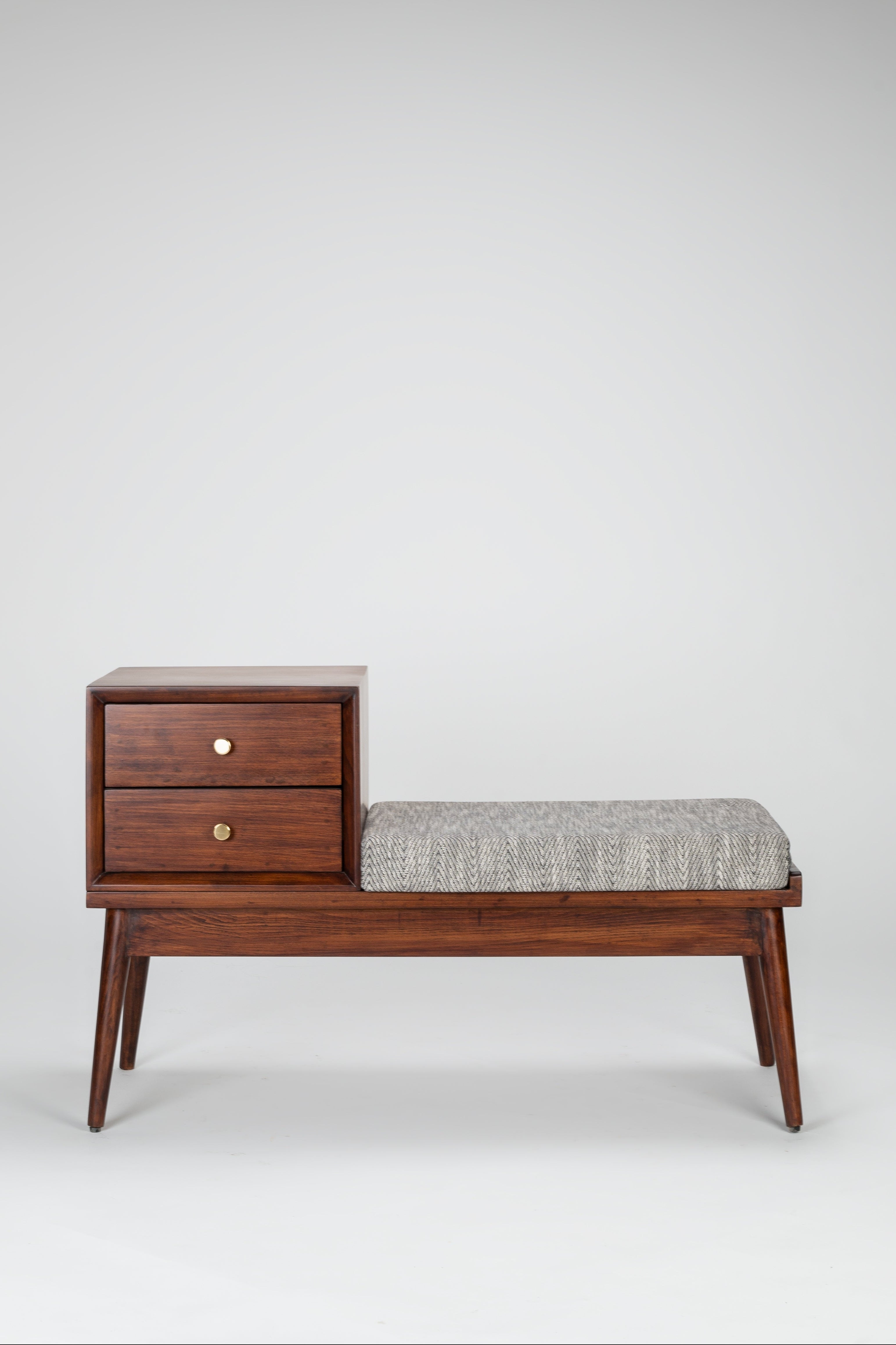 Wooden bench with storage drawers and a cushioned seat on a white background