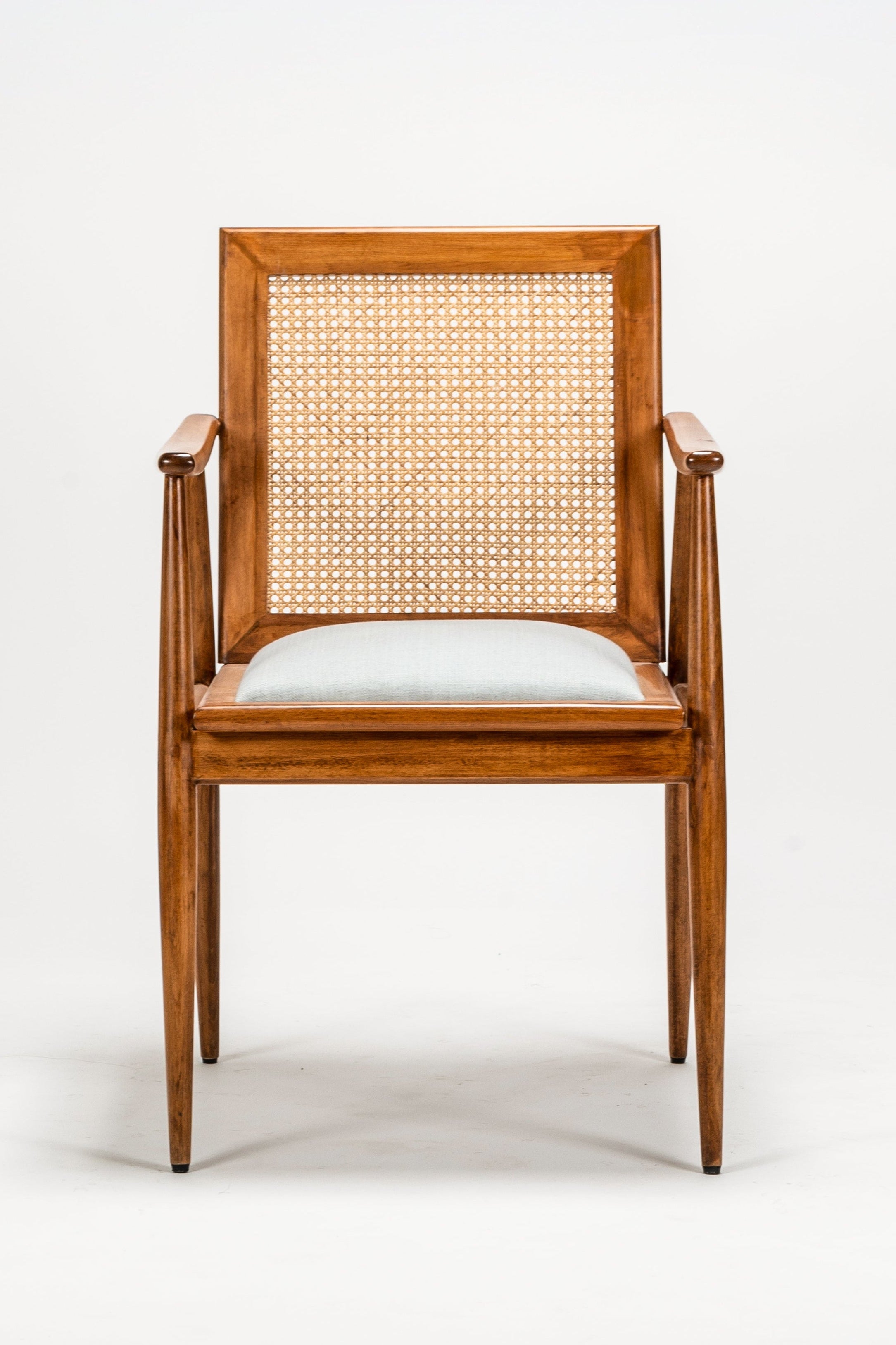 Wooden chair with woven backrest on a white background