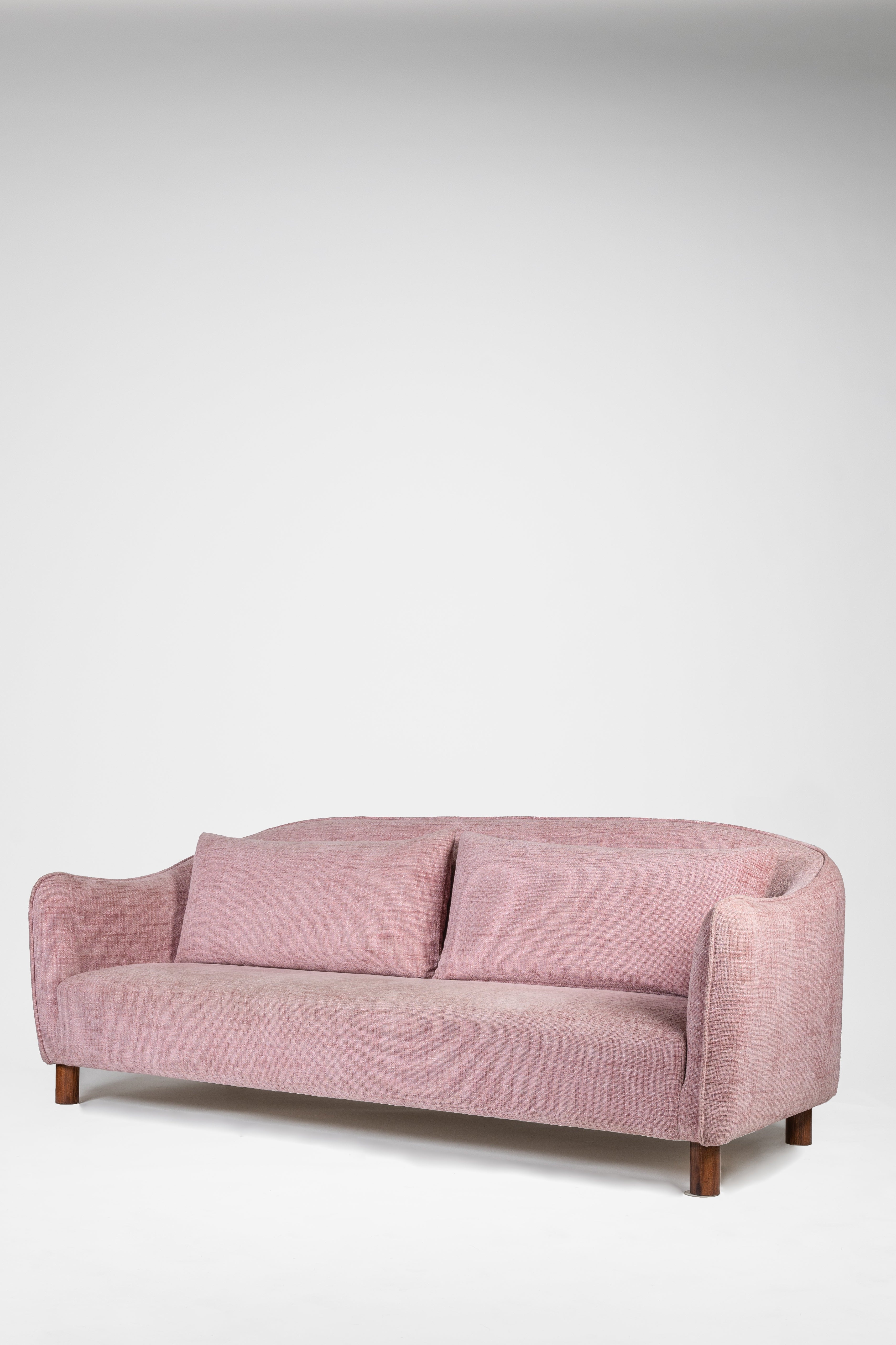 Pink sofa on a white background
