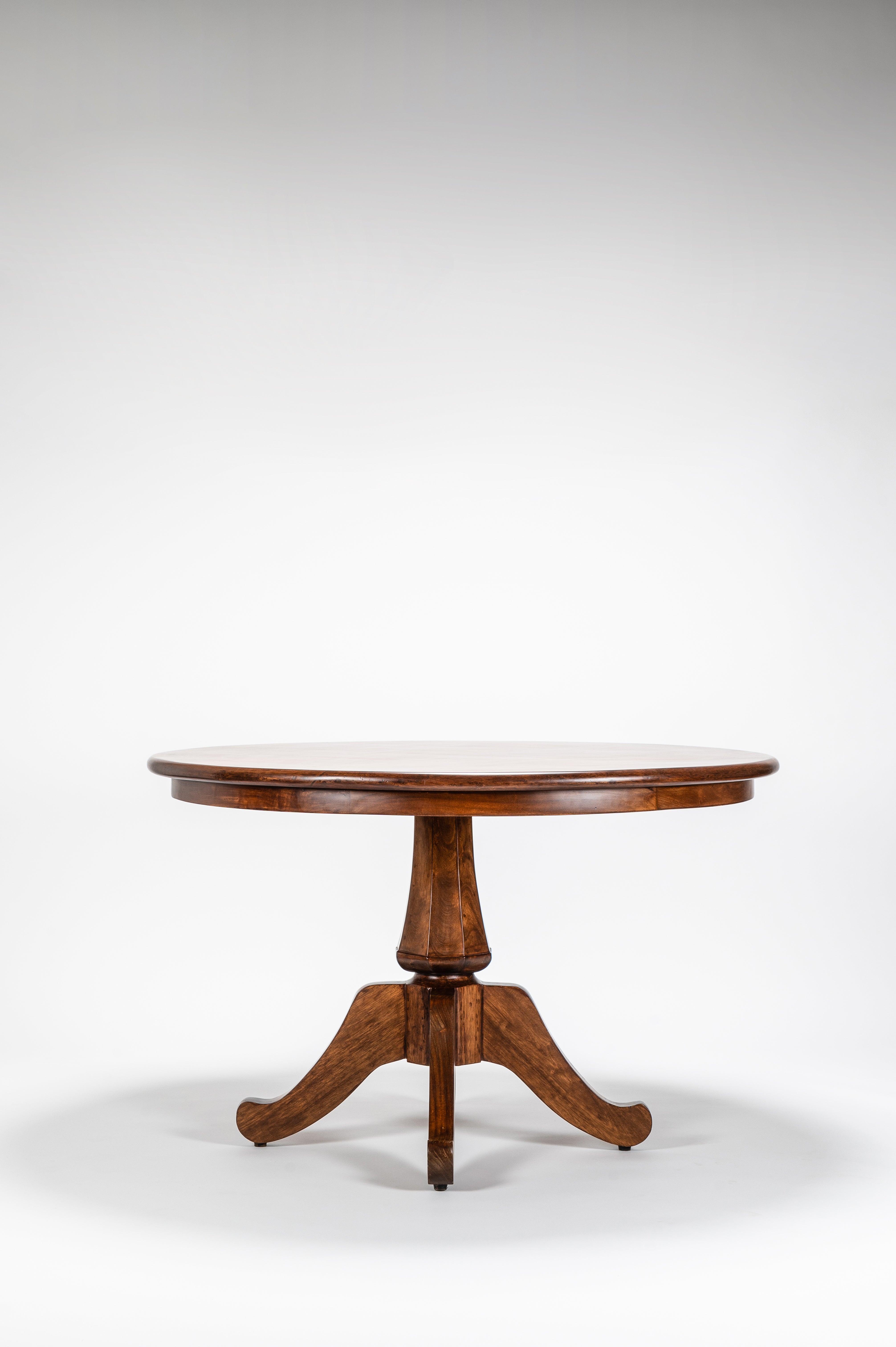 Wooden round table on a white background