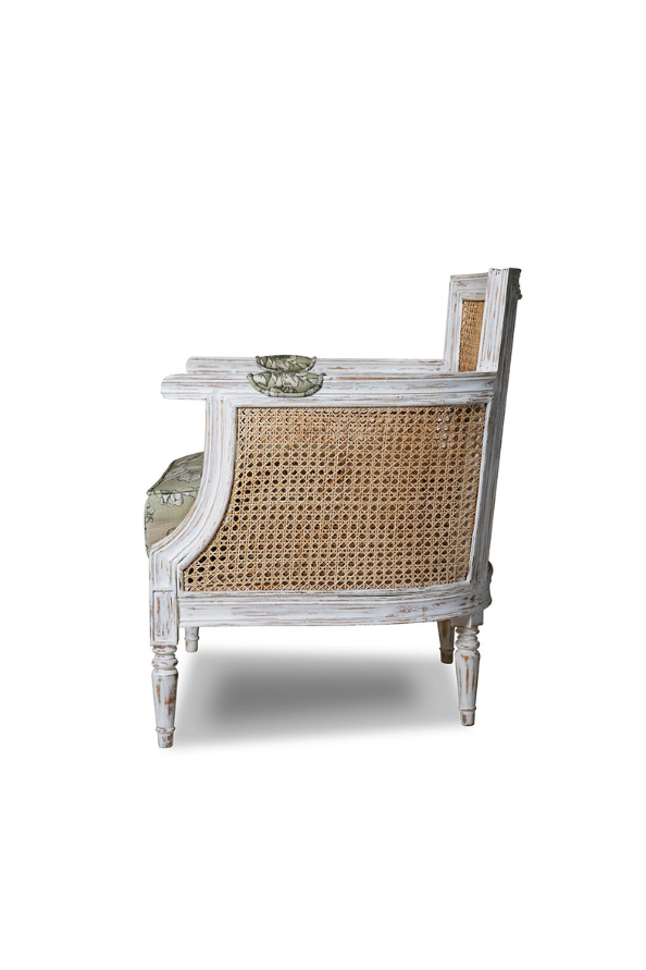 Vintage-style chair with wicker backrest and white wooden frame on a white background