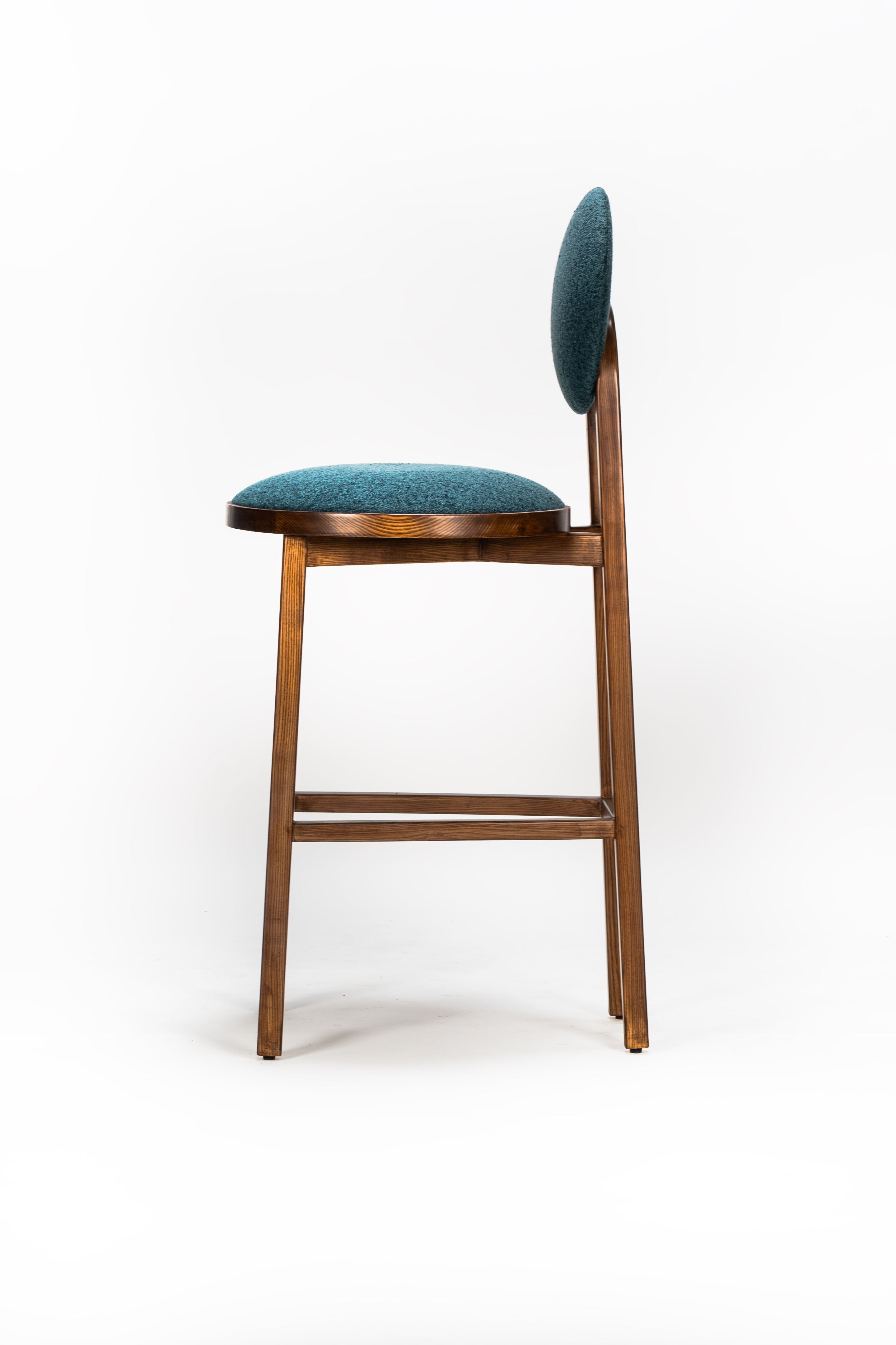 Chair with teal cushioned seat and backrest on a white background