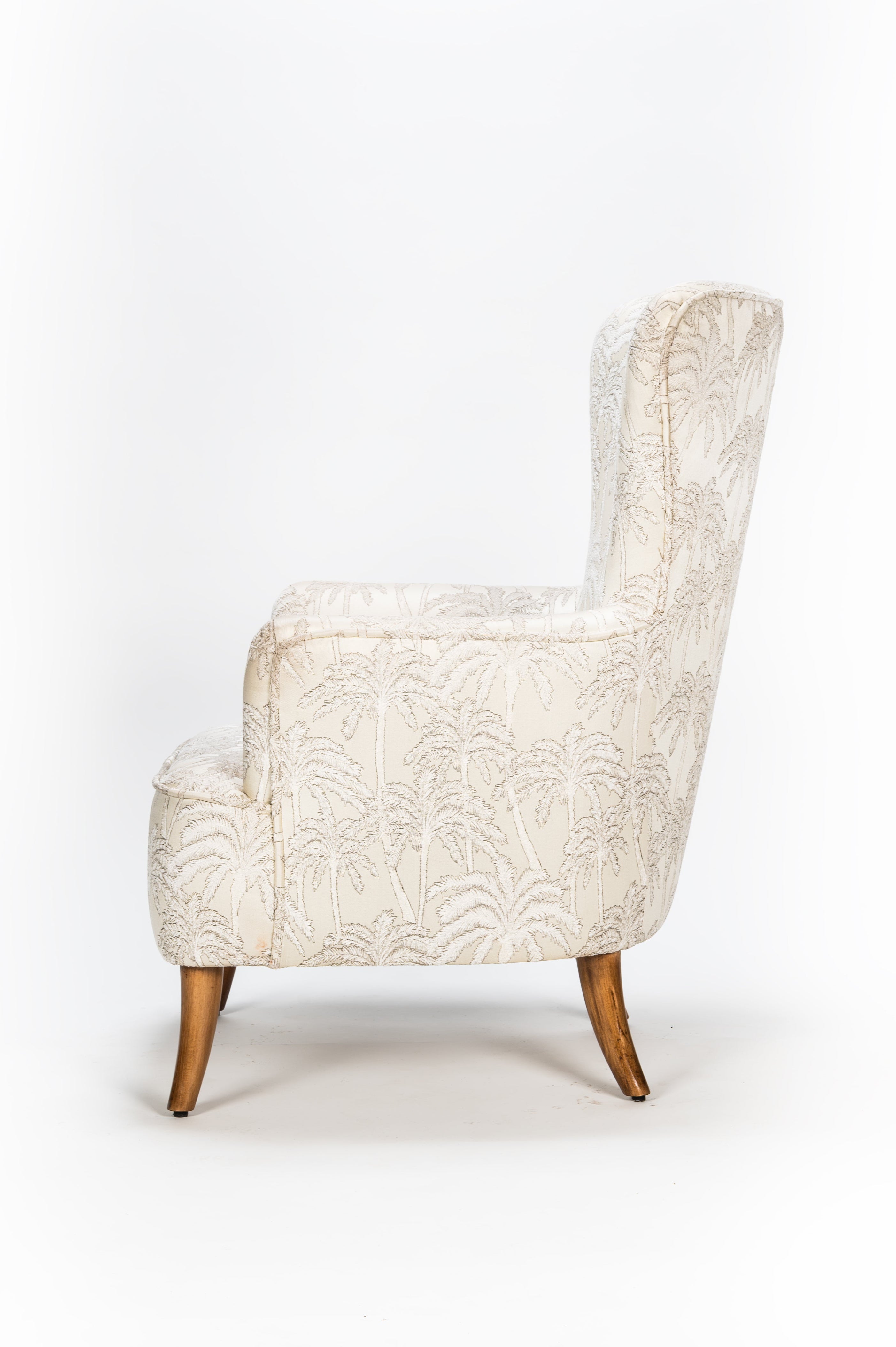 White armchair with wooden legs on a white background