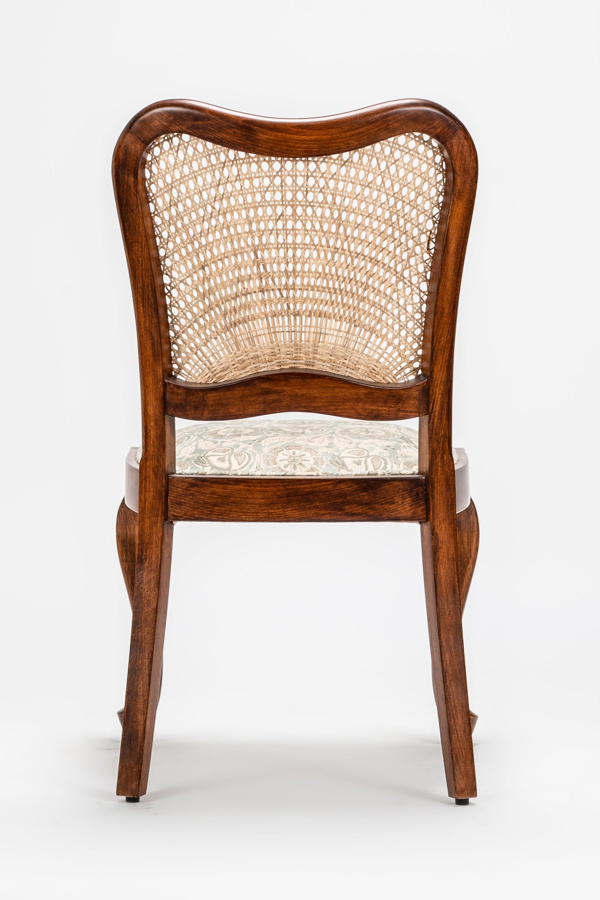 Wooden chair with wicker backrest on a white background