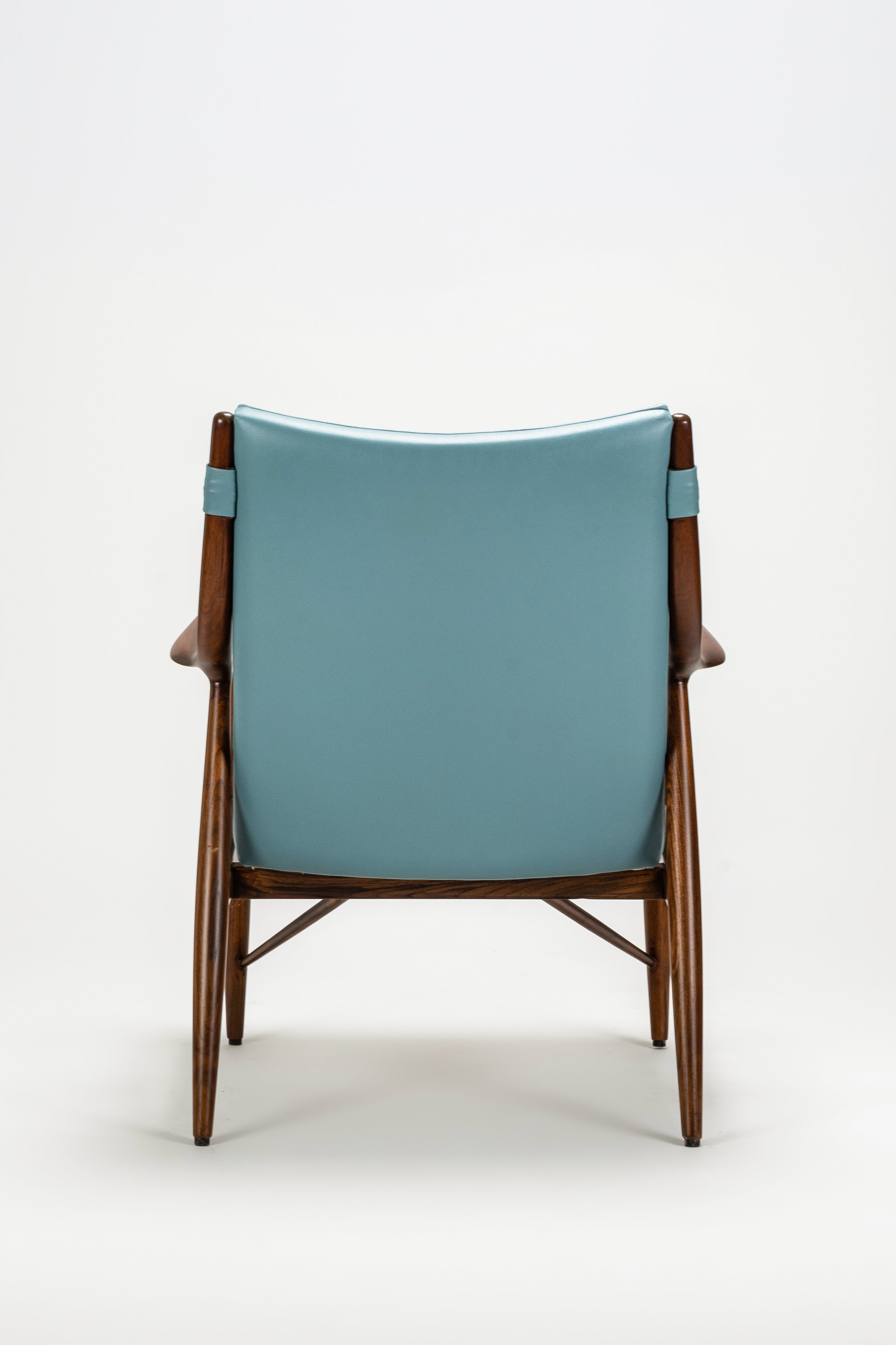 Chair with a blue cushion on a white background