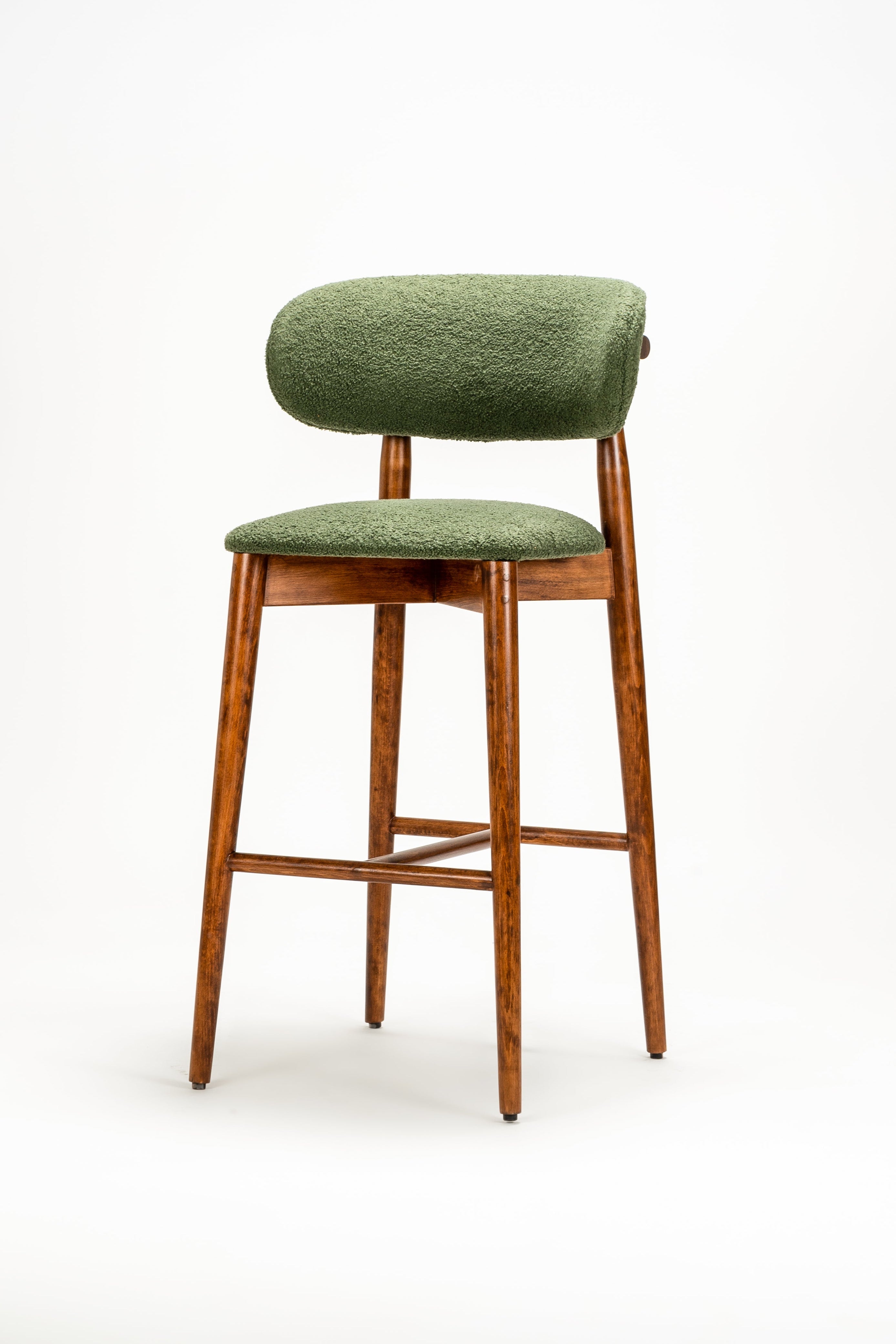 Green bar stool with wooden legs on a white background
