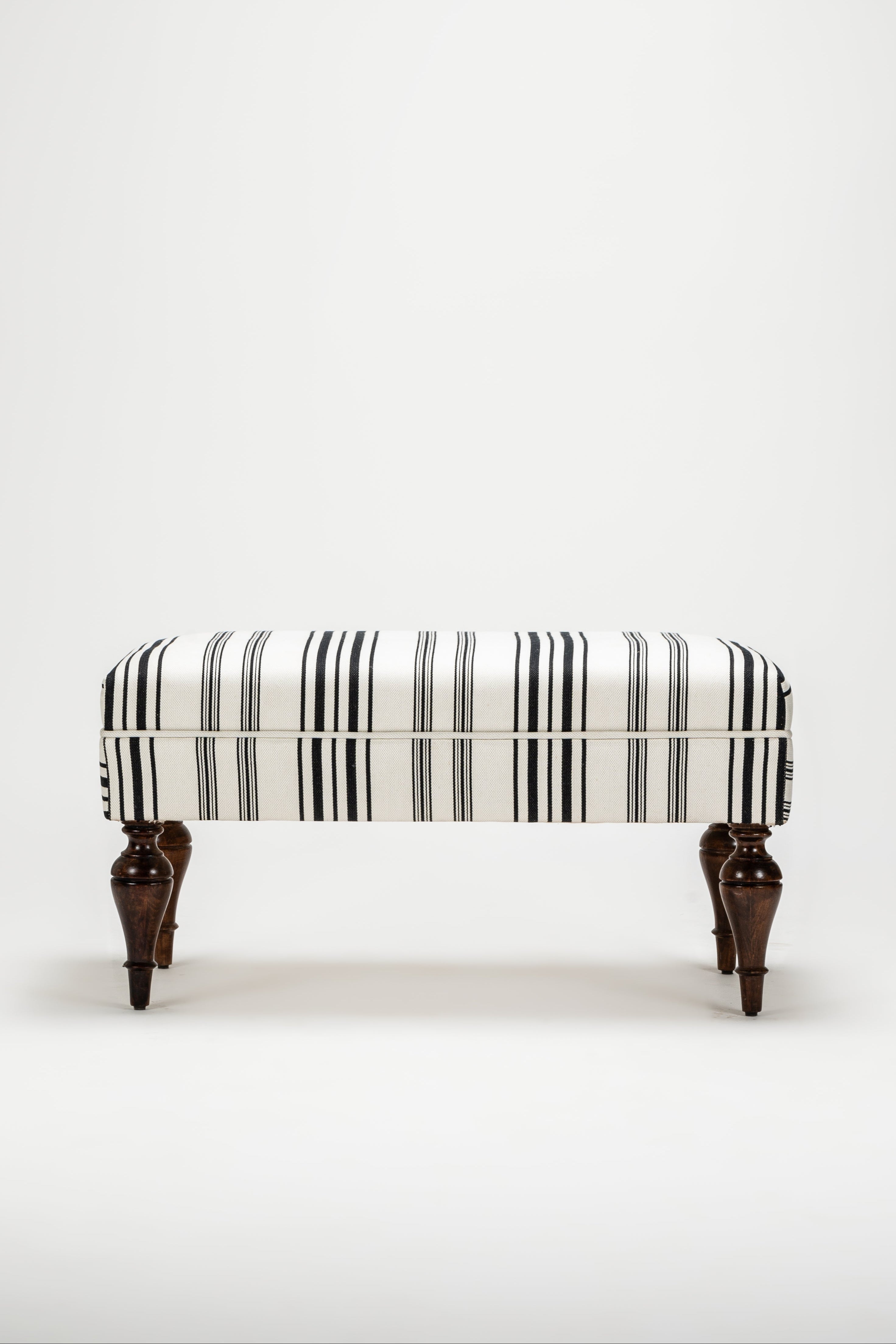 Striped bench with wooden legs on a white background