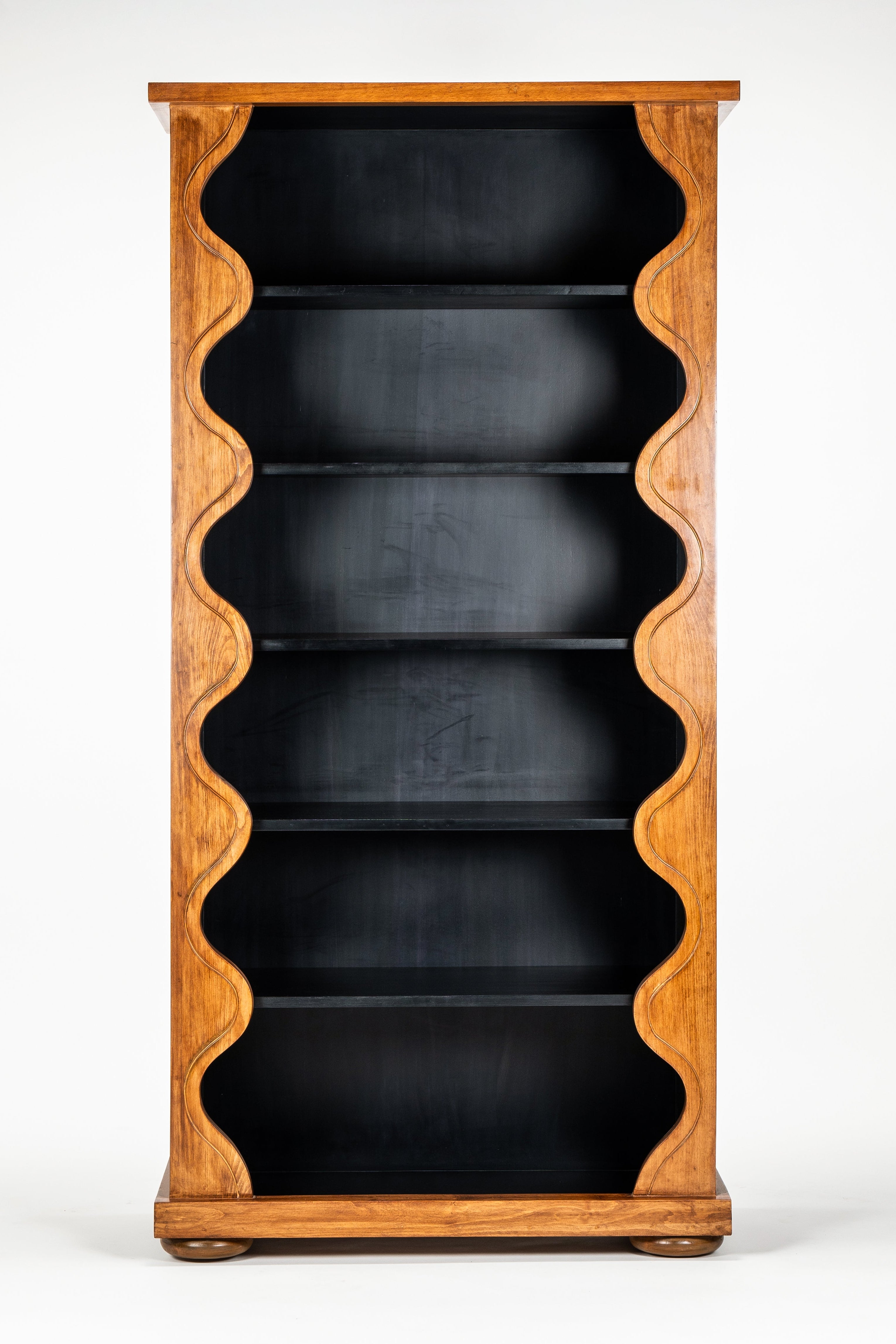 Wooden bookshelf with black shelves on a white background