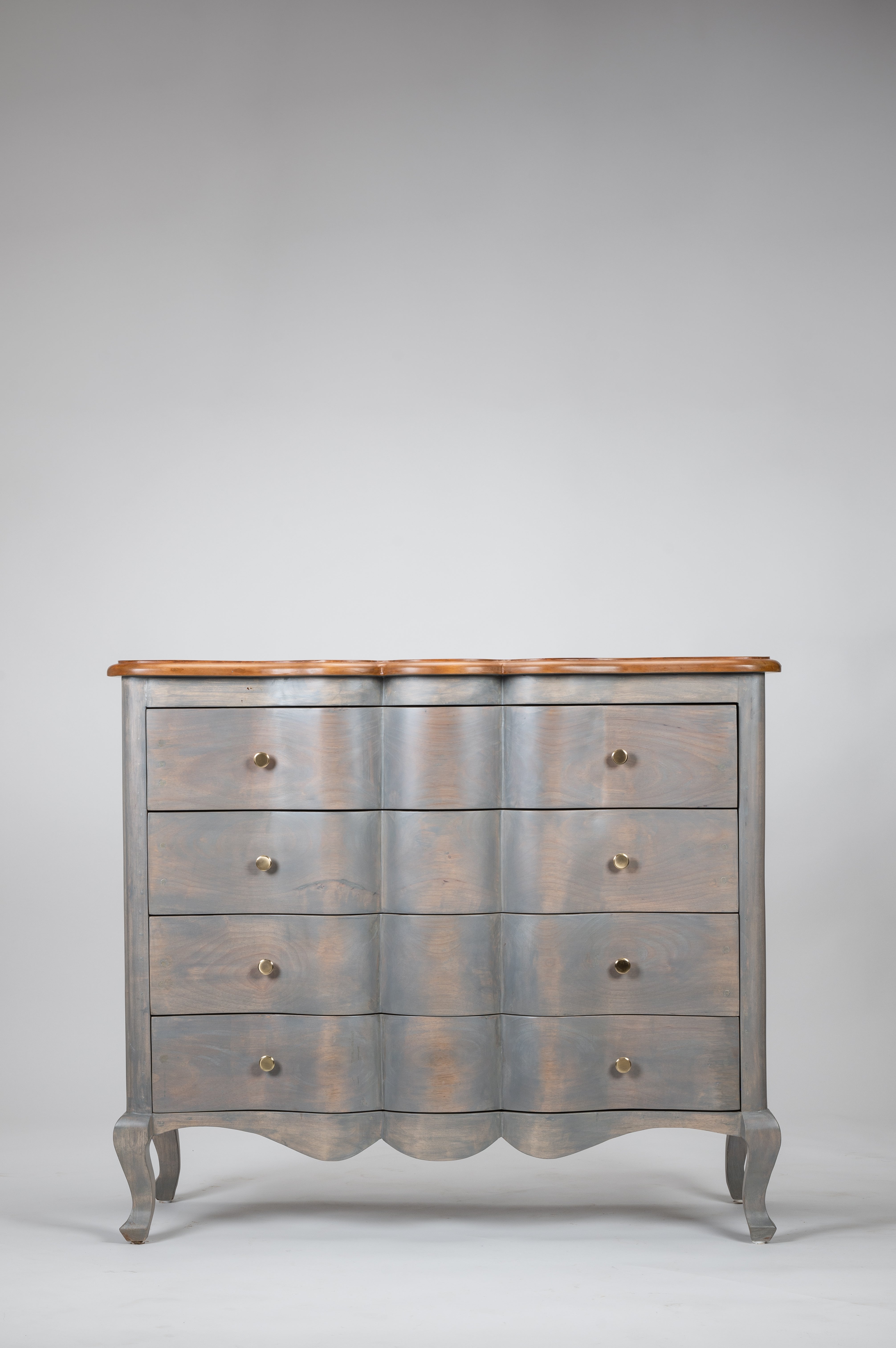 Wooden dresser with a grayish-blue finish on a white background